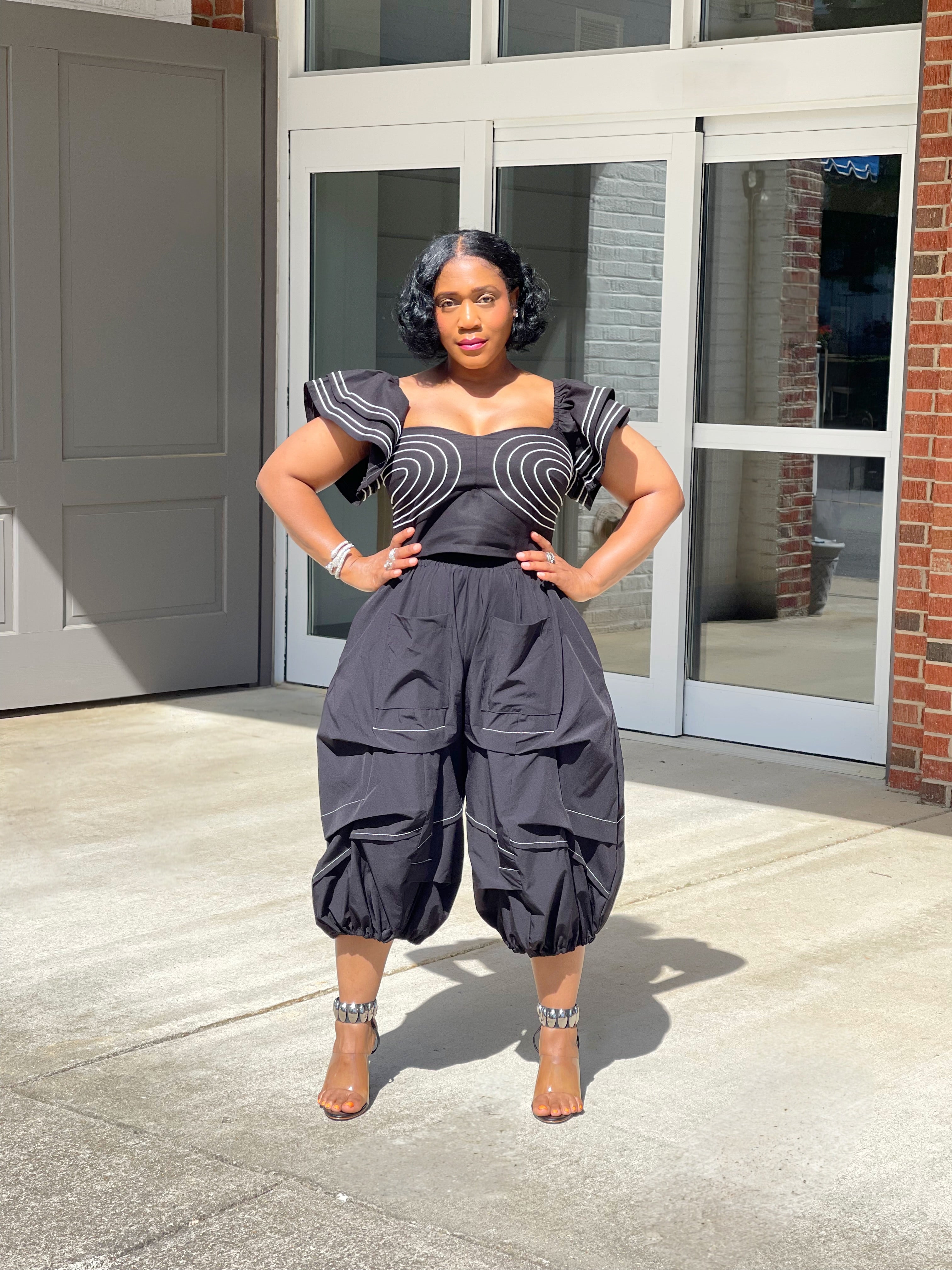 GOLDxTEAL stylish black crop pants with white contrasting stitching.