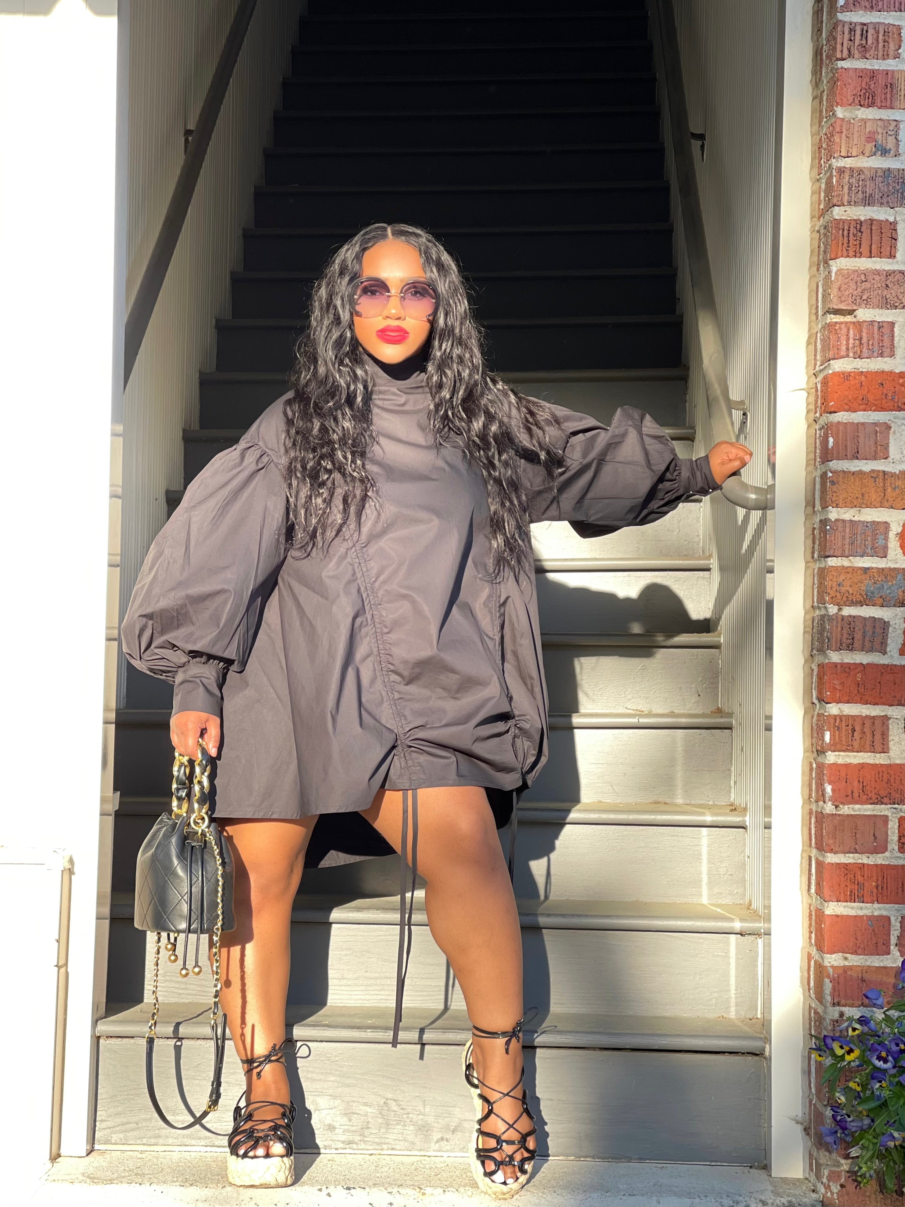 GOLDxTEAL black ruched mini dress.