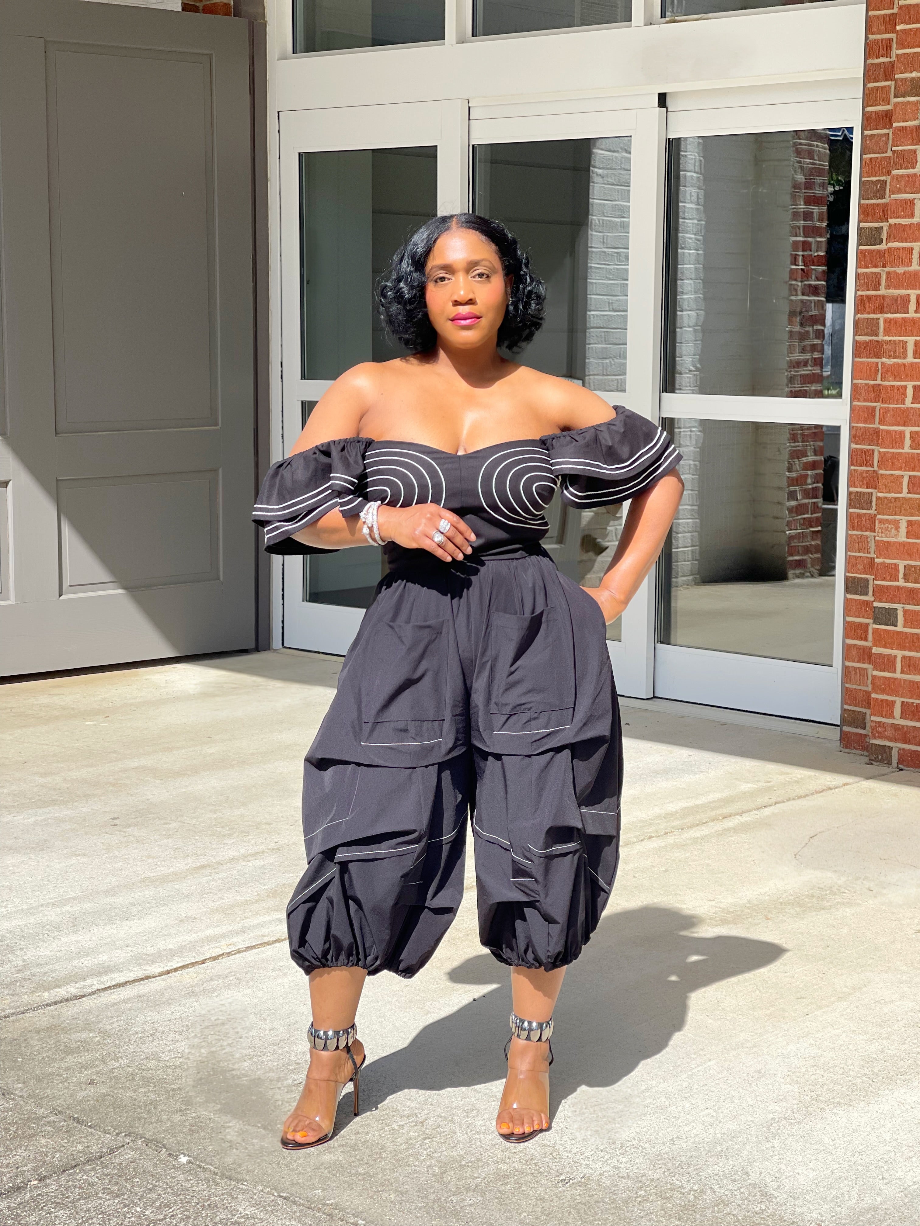 GOLDxTEAL stylish black crop pants with white contrasting stitching.