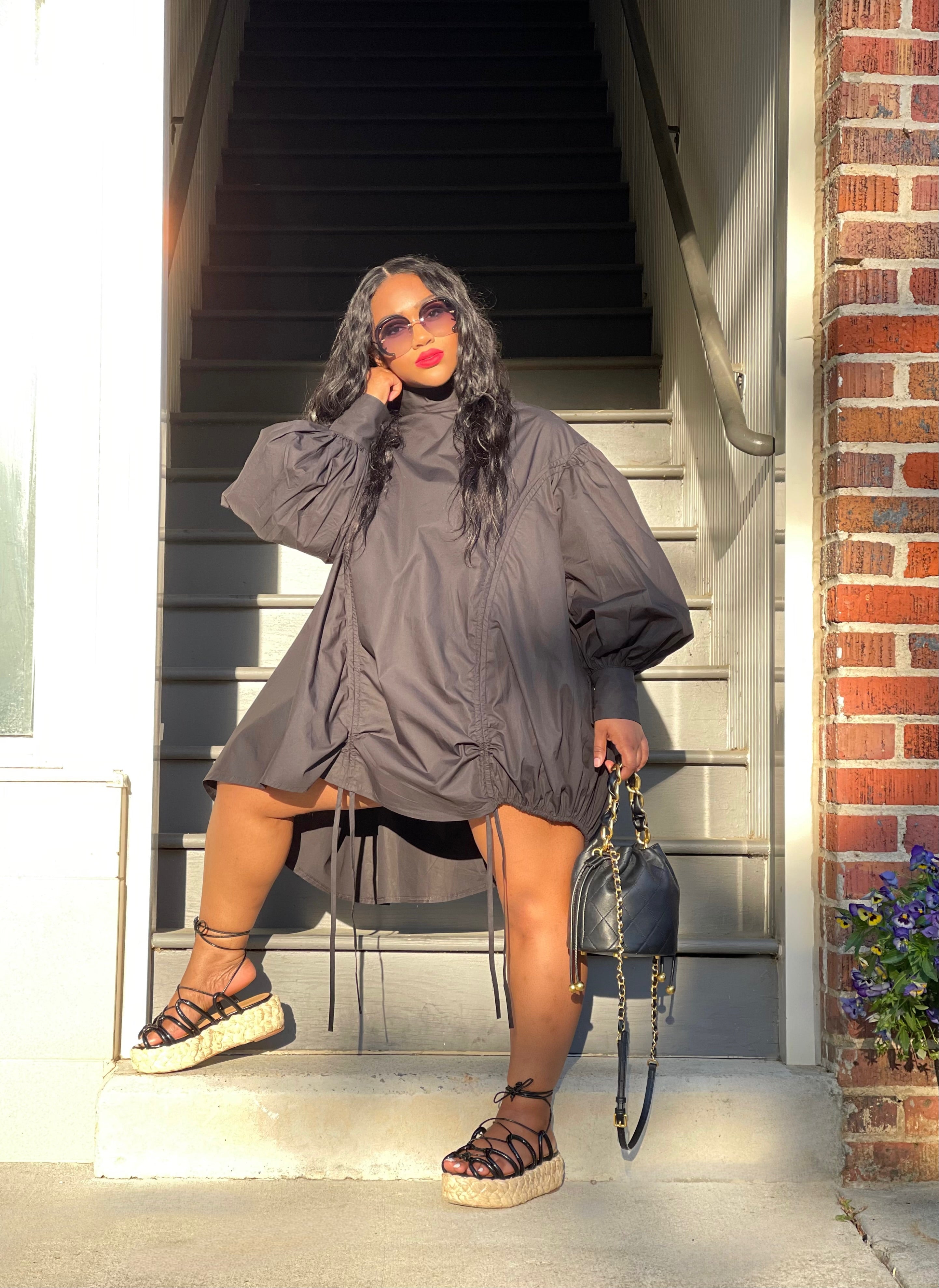 GOLDxTEAL black ruched mini dress.