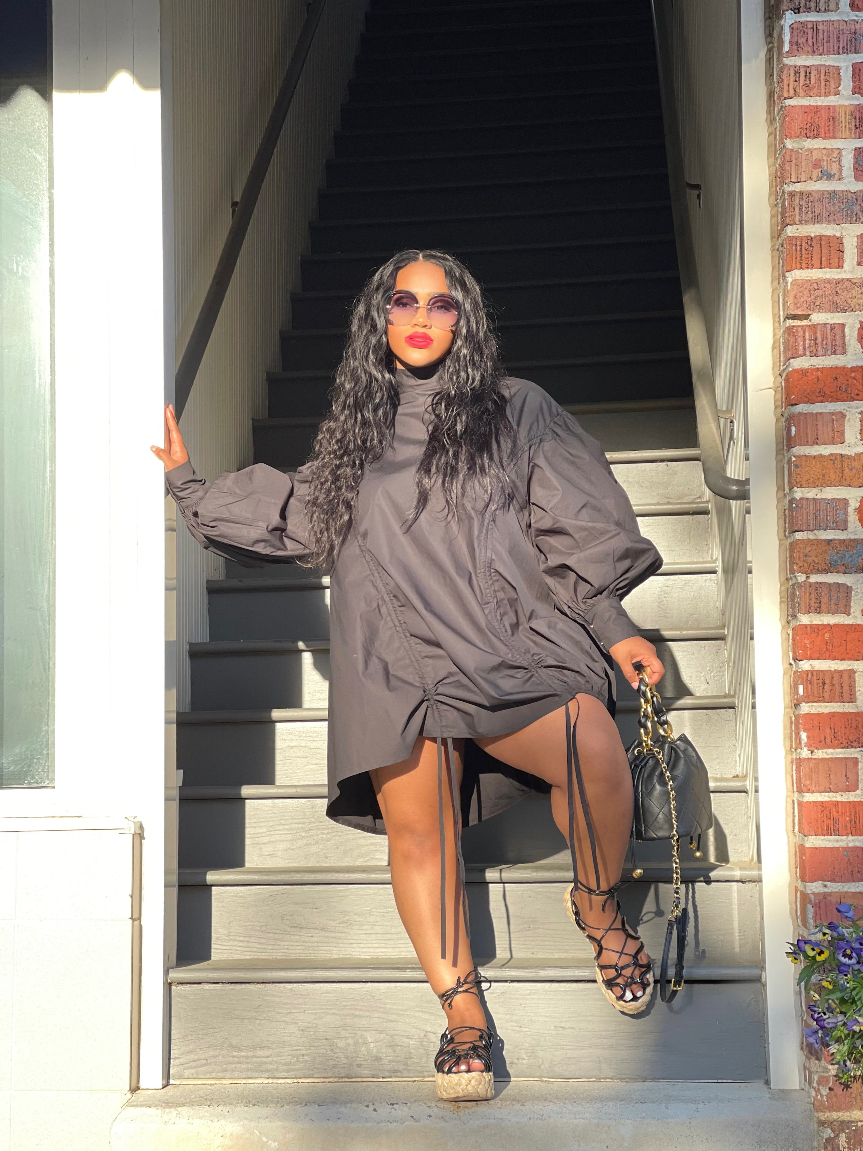 GOLDxTEAL black ruched mini dress.