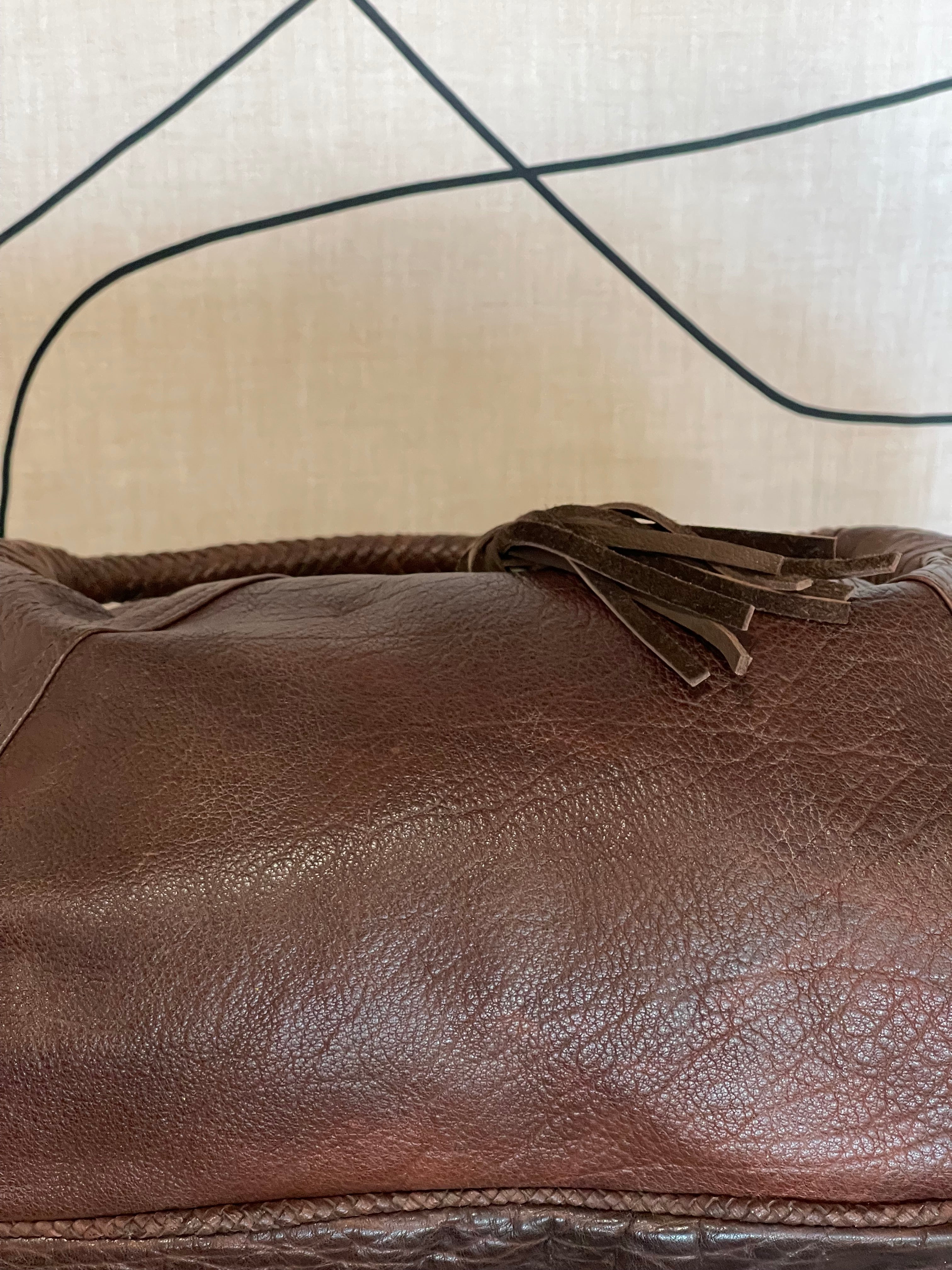 Bottom view of Mousse Hobo Handbag by GOLD x TEAL highlighting structured leather base and pebbled texture finish