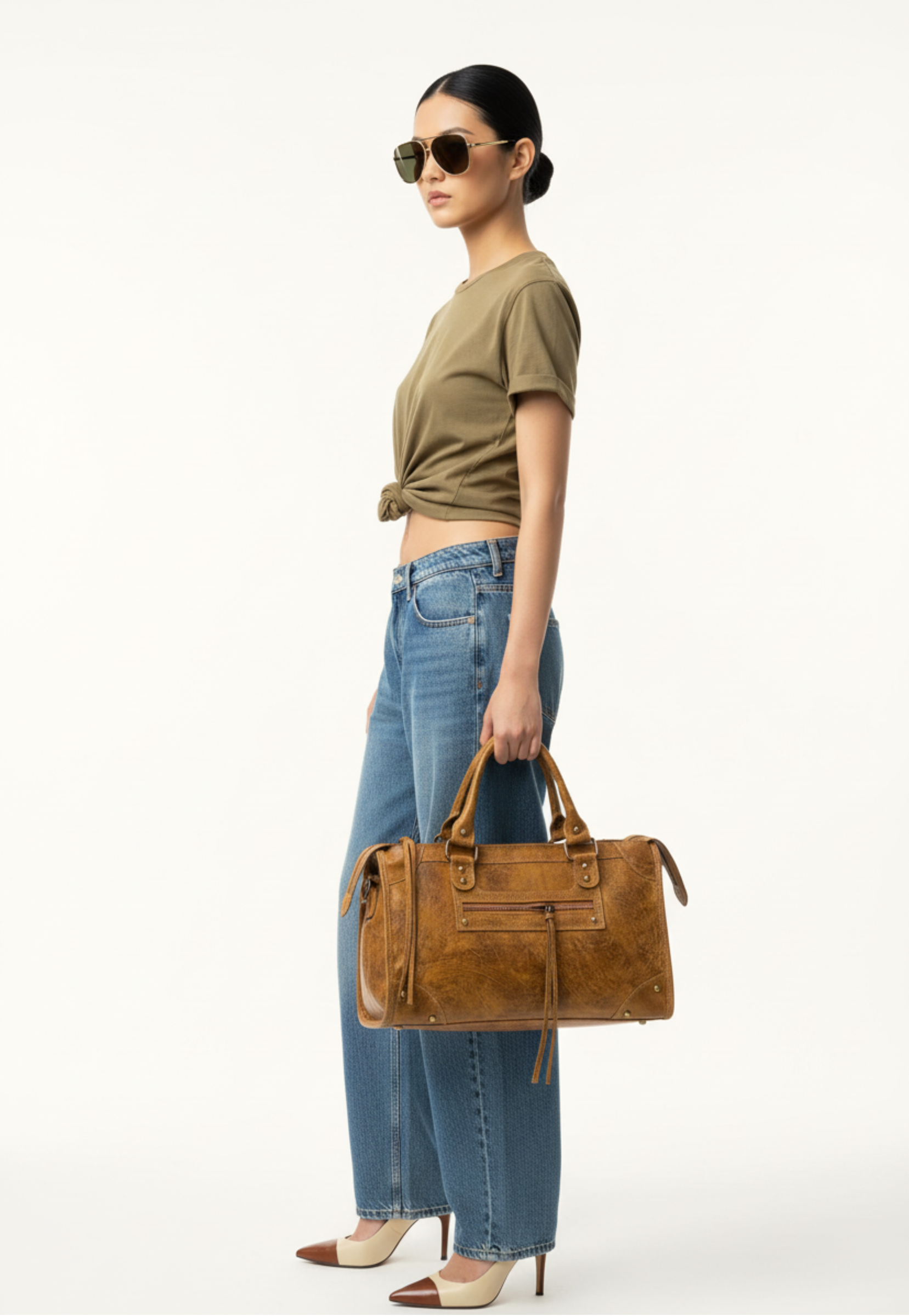 Model holding Verona Heritage Satchel in cognac leather by GOLD x TEAL.