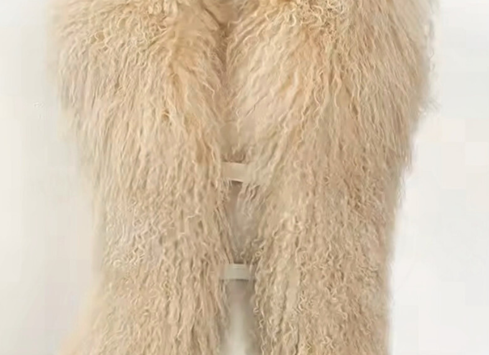 Close-up detail of cream Mongolian fur texture on the GOLD x TEAL Nomad Fur Scarf Vest highlighting natural curl and variation.