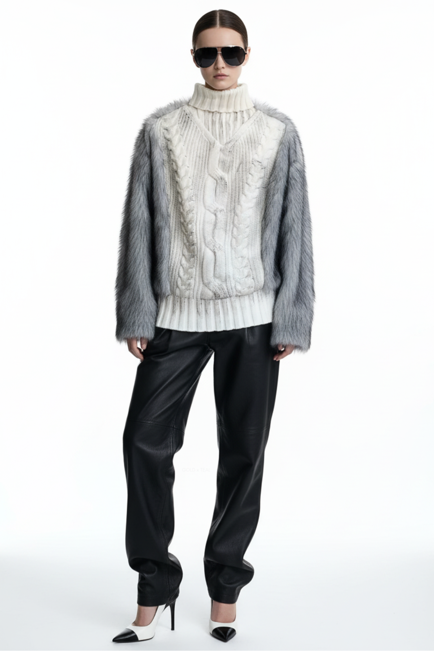 GOLD x TEAL Maison Fur Sweater in white shown on model, cable knit turtleneck sweater with faux fur sleeves and faux fur back panel.
