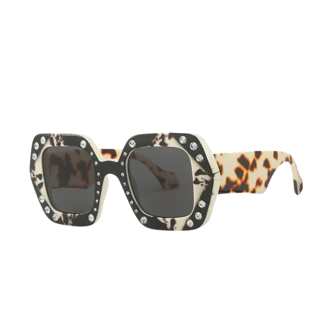 GOLDxTEAL oversized square frame sunglasses with stone embellishments.