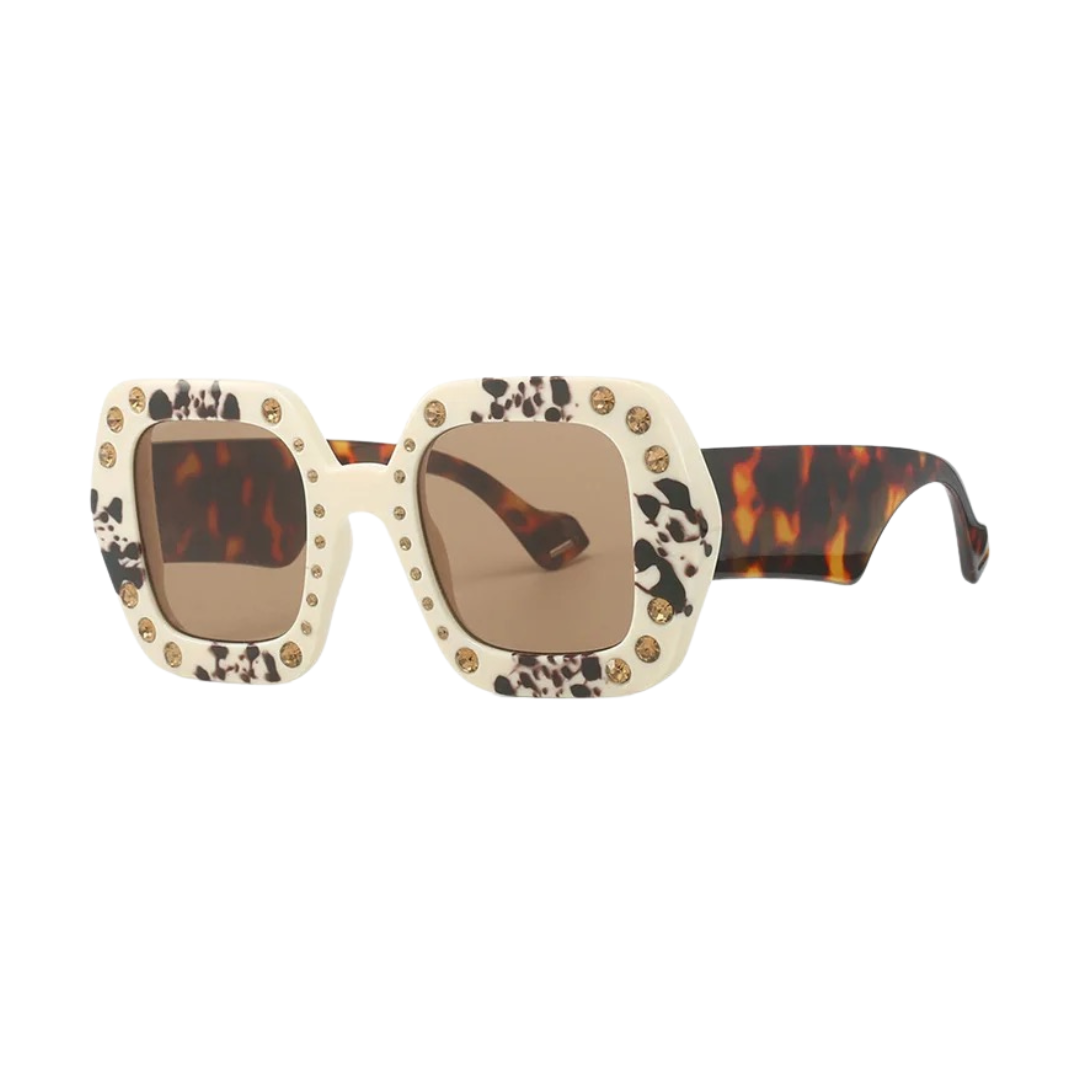 GOLDxTEAL oversized square frame sunglasses with stone embellishments.