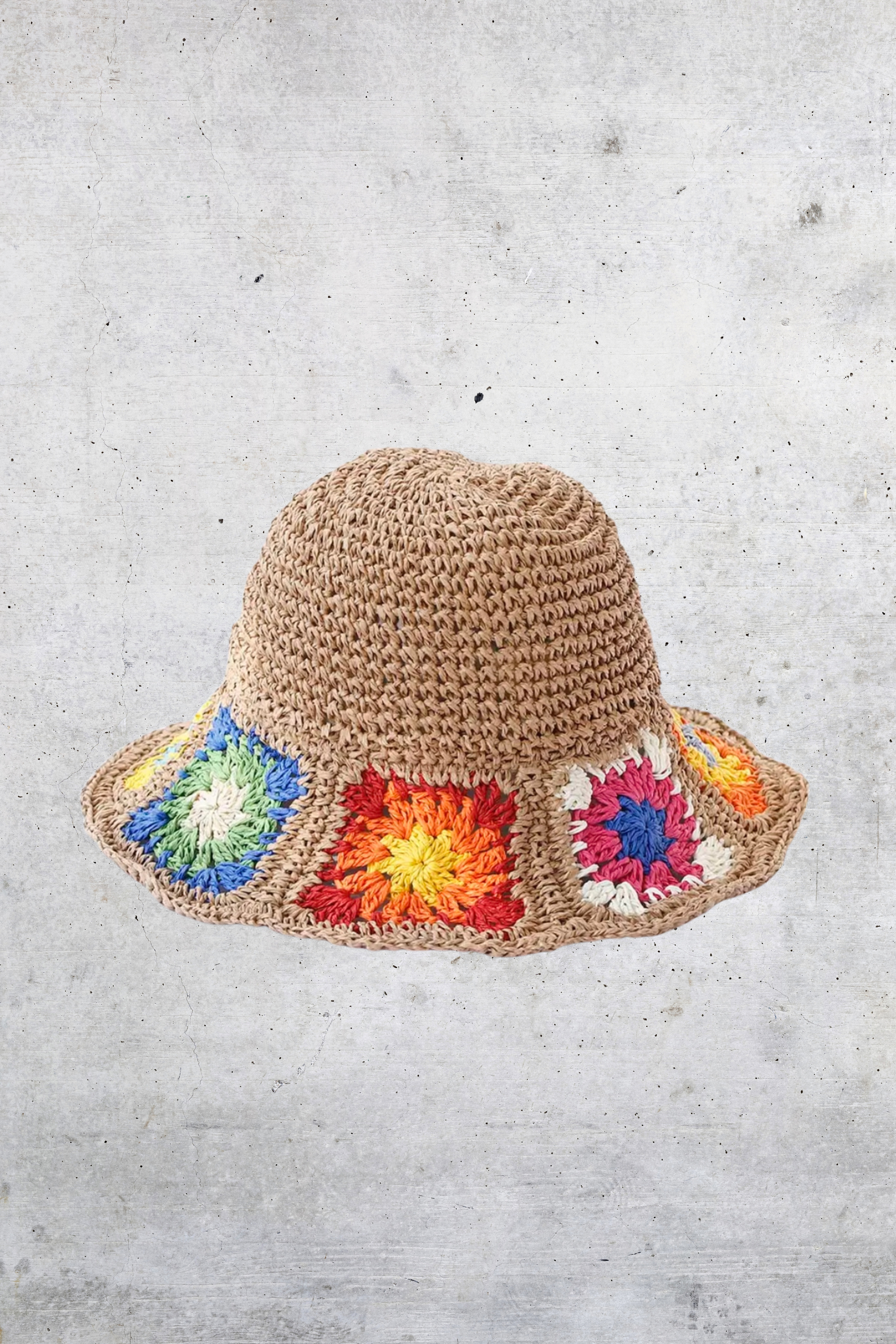 GOLDxTEAL straw bucket hat featuring colorful patchwork.