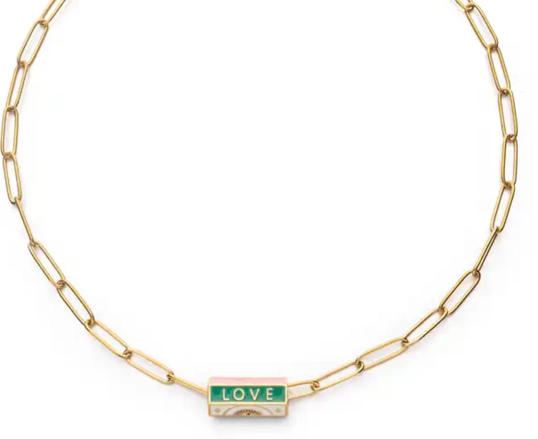 Gorgeous and fun vintage style enameled necklace. Chic gold plated paperclip chain topped with a hand engraved and hand enameled rolled pendant.