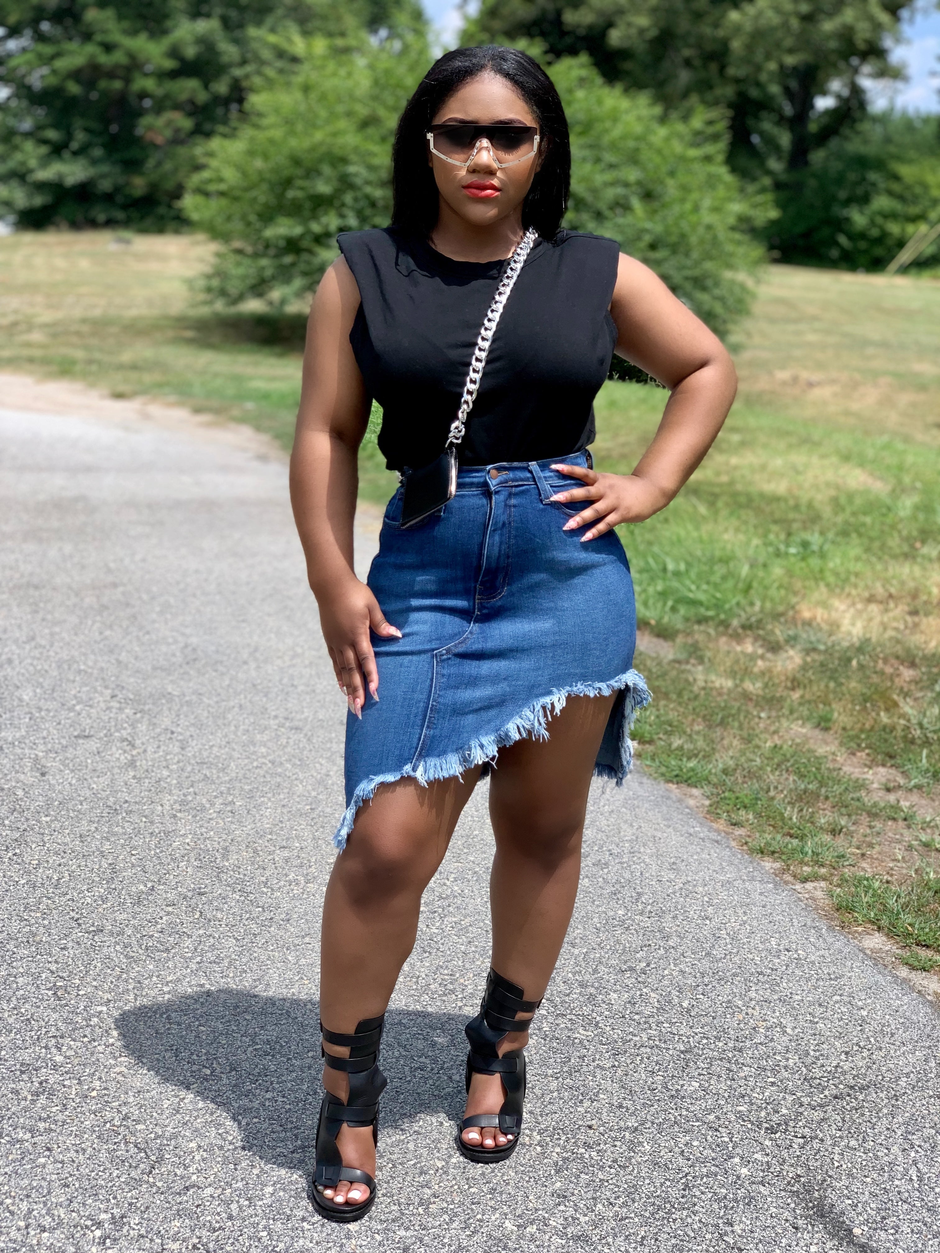 GOLDxTEAL Rock With Me denim skirt. Distressed high waist denim skirt with an asymmetrical bottom and raw edge hem.