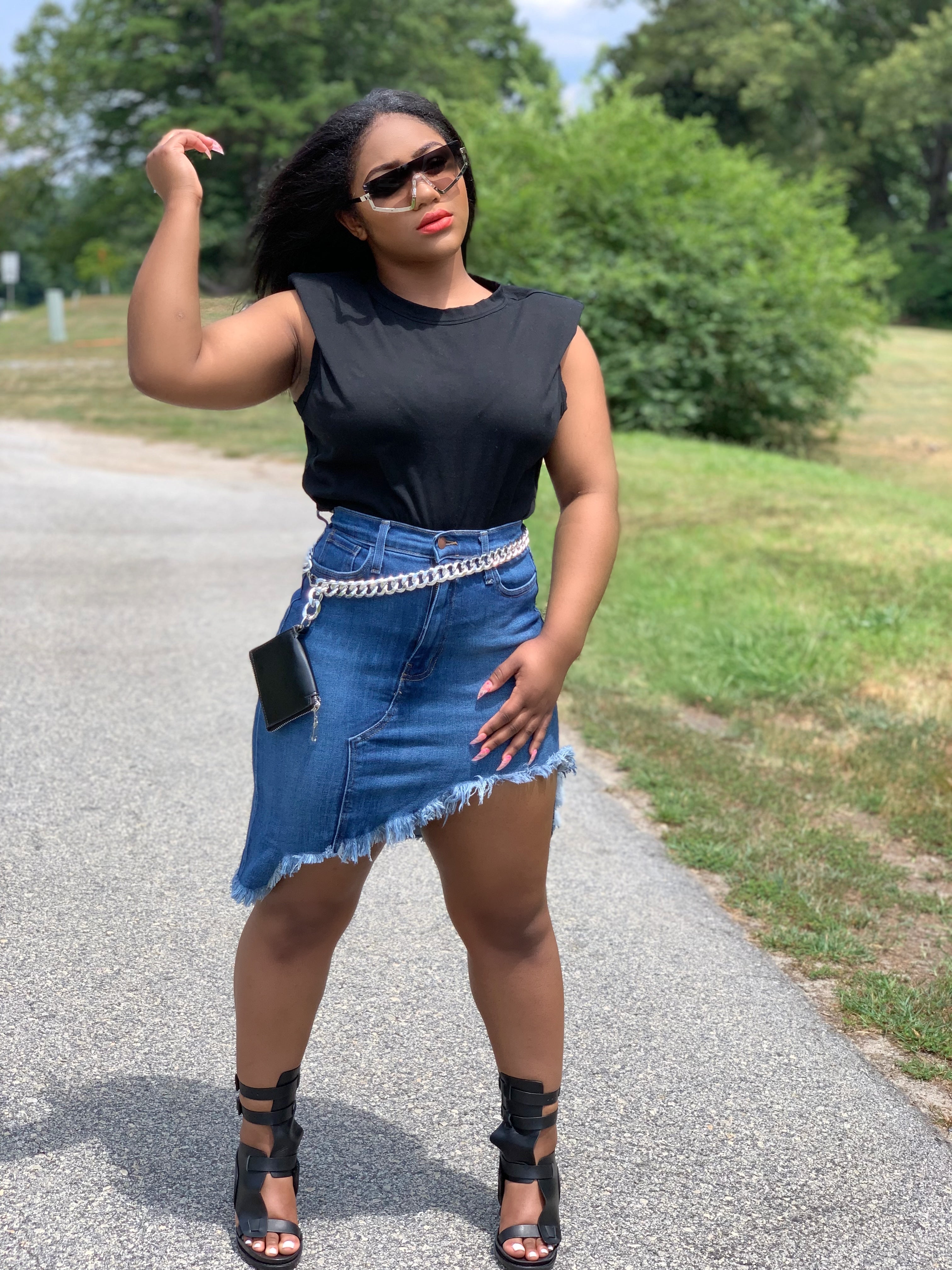 GOLDxTEAL Rock With Me denim skirt. Distressed high waist denim skirt with an asymmetrical bottom and raw edge hem.