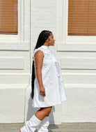GOLDxTEAL A-line white petal embellished crystal shift dress.
