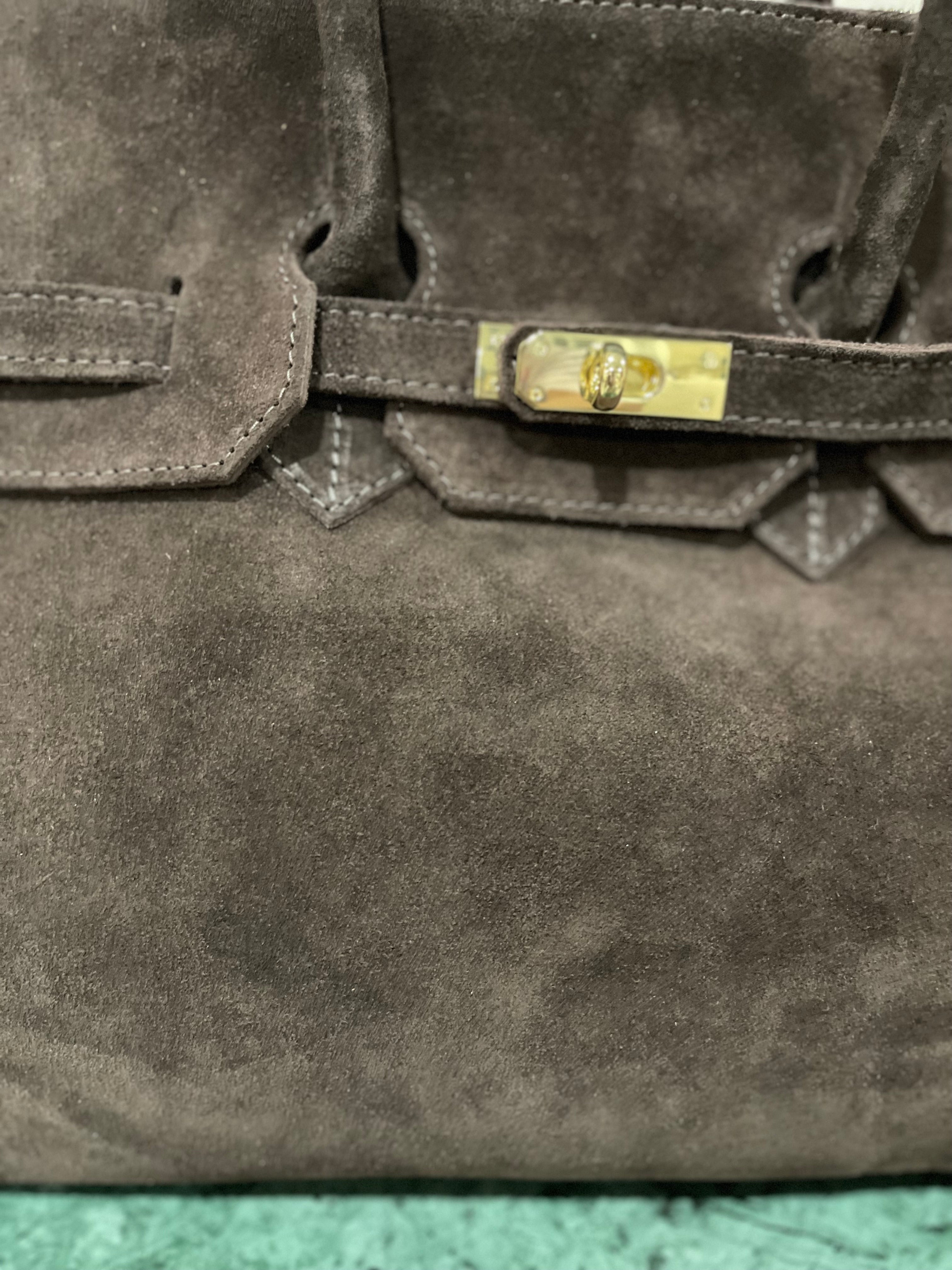 GOLDxTEAL timeless suede leather handbag.
