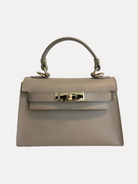 GOLDxTEAL taupe leather mini crossbody handbag.