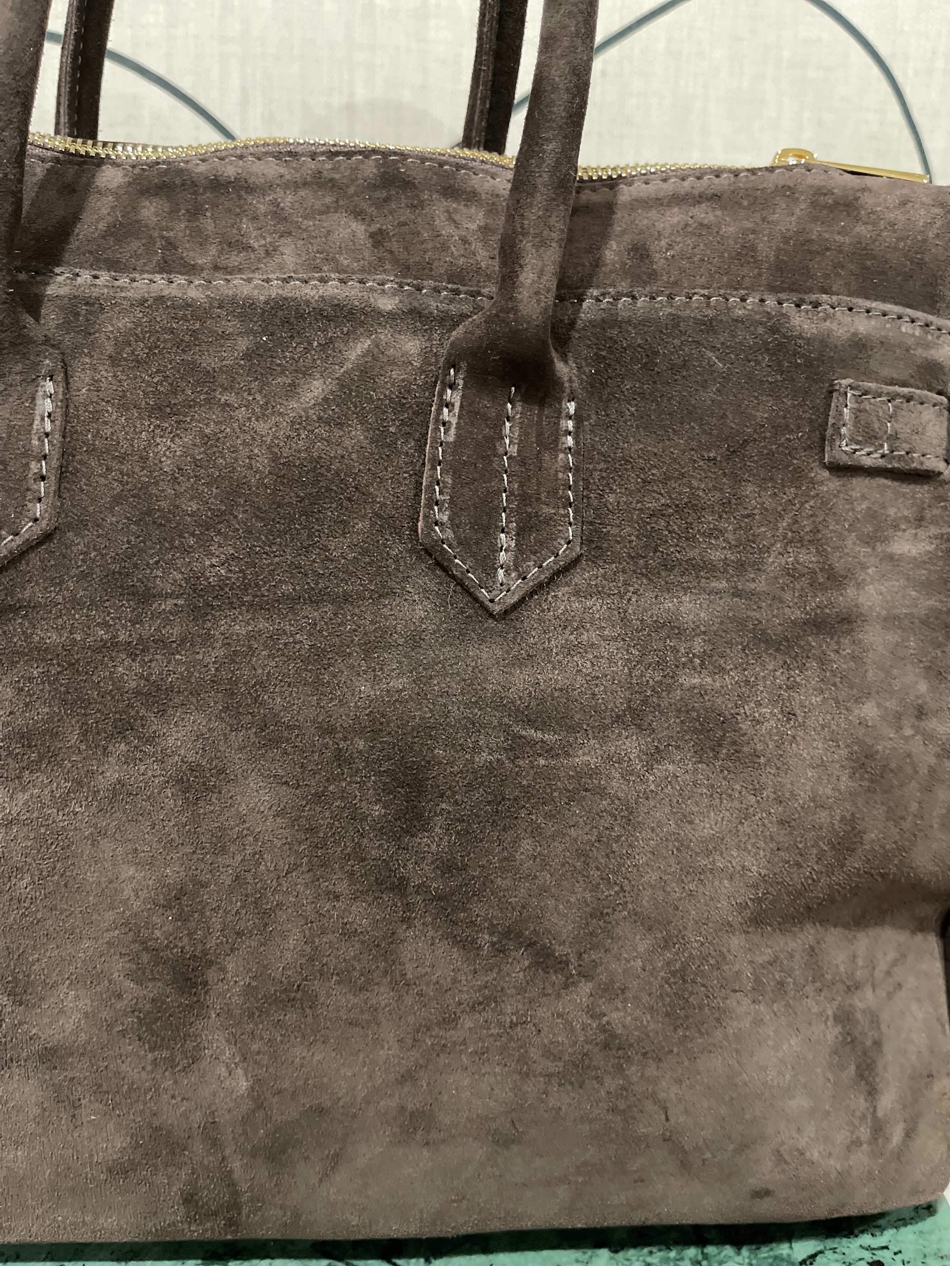 GOLDxTEAL timeless suede leather handbag.