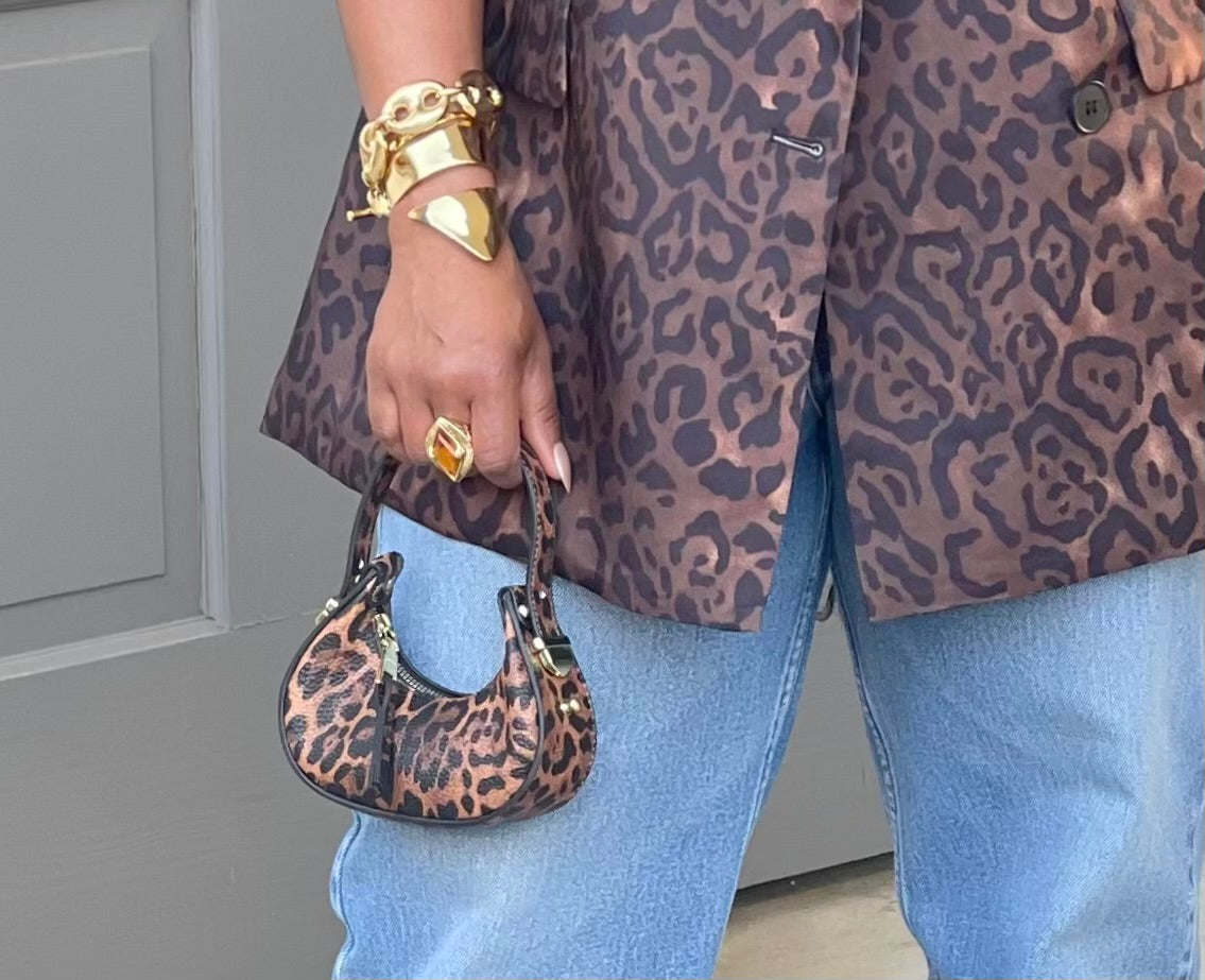 GOLDxTEAL leopard printed vegan leather micro handbag.