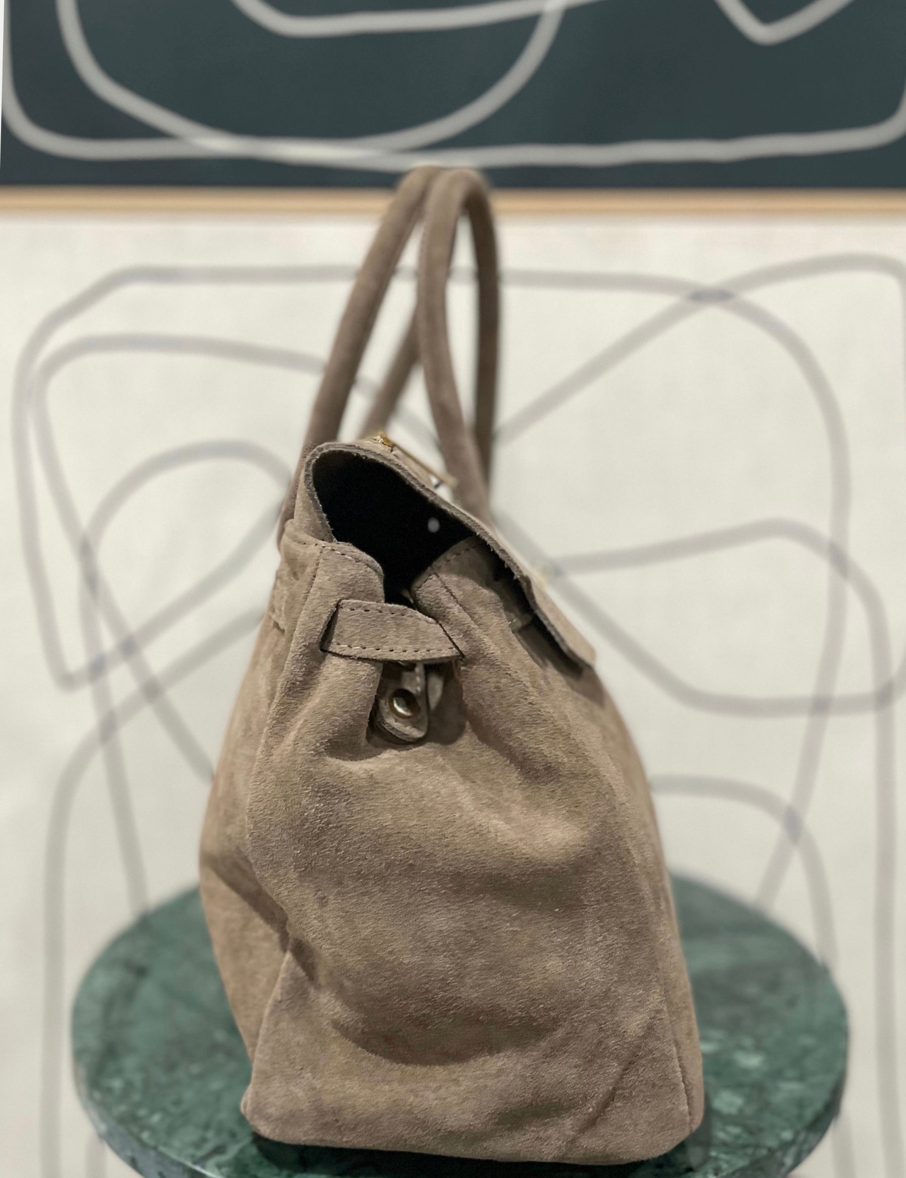 GOLDxTEAL timeless suede leather handbag.