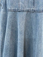 GOLDxTEAL pleated denim skirt.