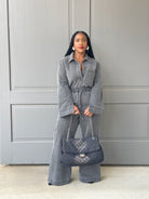 GOLDxTEAL denim quilted handbag with chain strap.