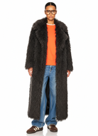 Model wearing the GOLD x TEAL Mocha Opulence Coat in rich mocha faux Mongolian fur, full-length front view.