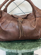 GOLDxTEAL gorgeous leather cognac hobo bag.