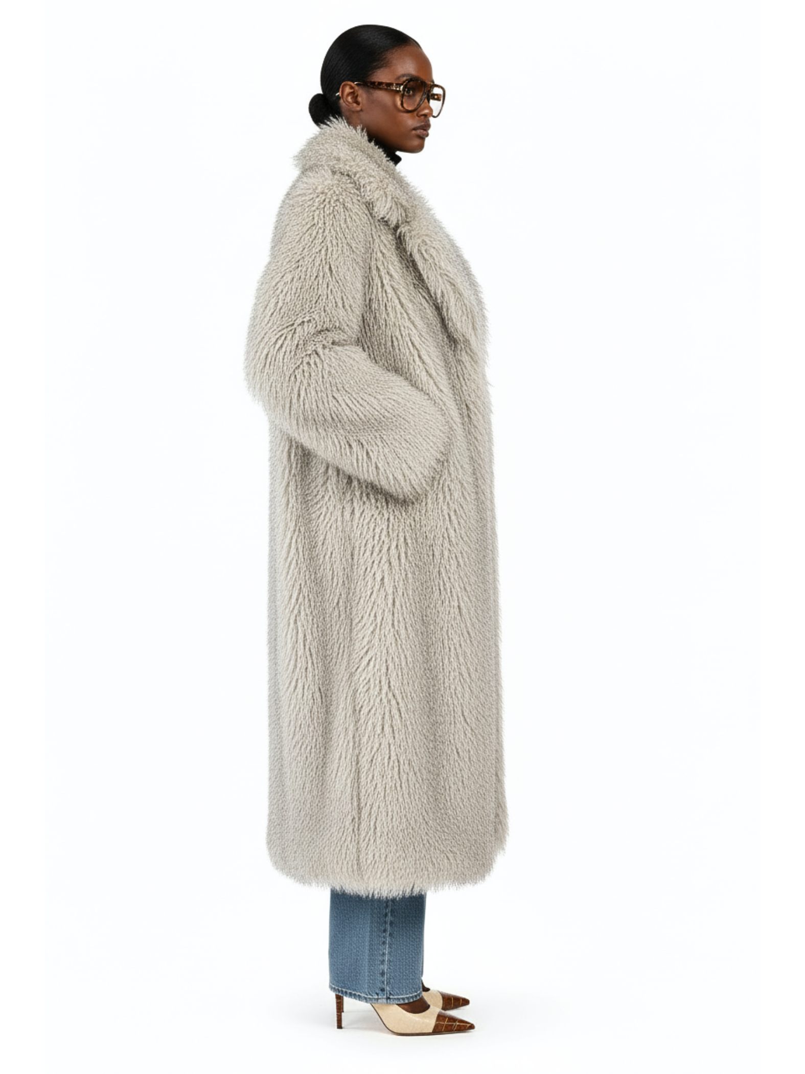 Side profile of the GOLD x TEAL Frost Luxe Coat highlighting plush faux Mongolian fur texture, long silhouette, and draped side detail.