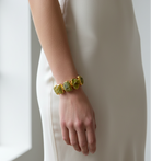 Raw green opal stone bracelet with gold-plated brass trim by GOLD x TEAL  on model.