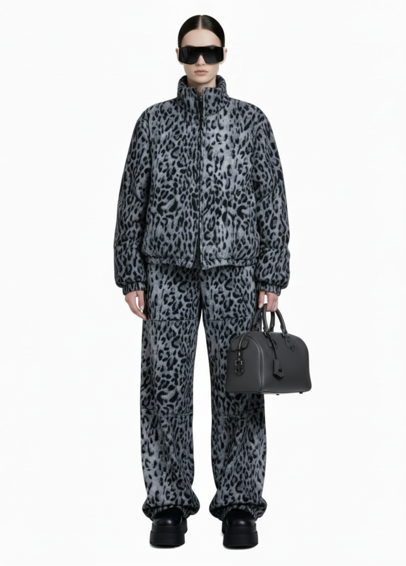 Model wearing the Savanna Off-Duty Set with relaxed fit zip jacket and elastic waist wide-leg pants from GOLD x TEAL.