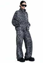 Model wearing the Savanna Off-Duty Set with relaxed fit zip jacket and elastic waist wide-leg pants from GOLD x TEAL.