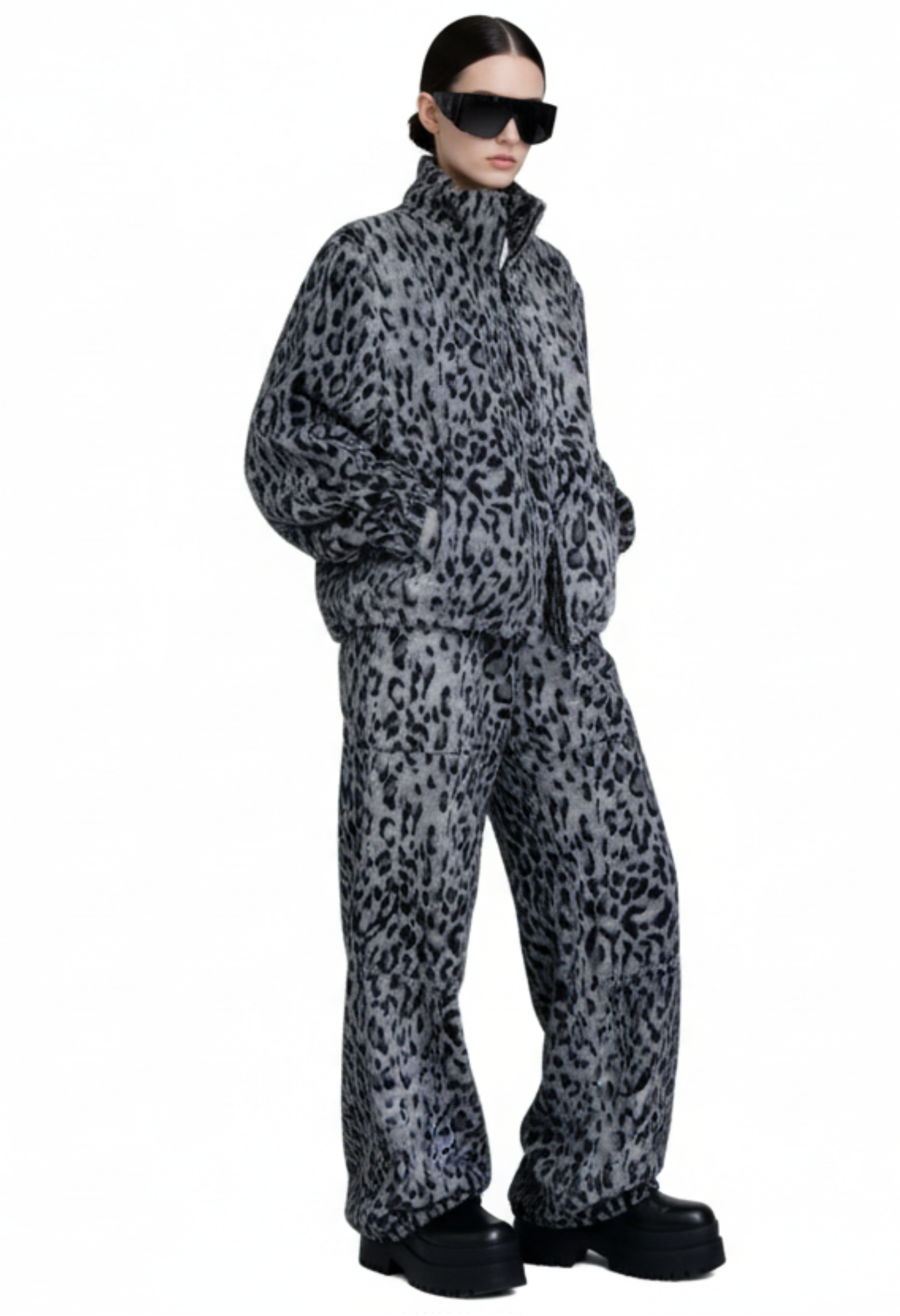 Model wearing the Savanna Off-Duty Set with relaxed fit zip jacket and elastic waist wide-leg pants from GOLD x TEAL.