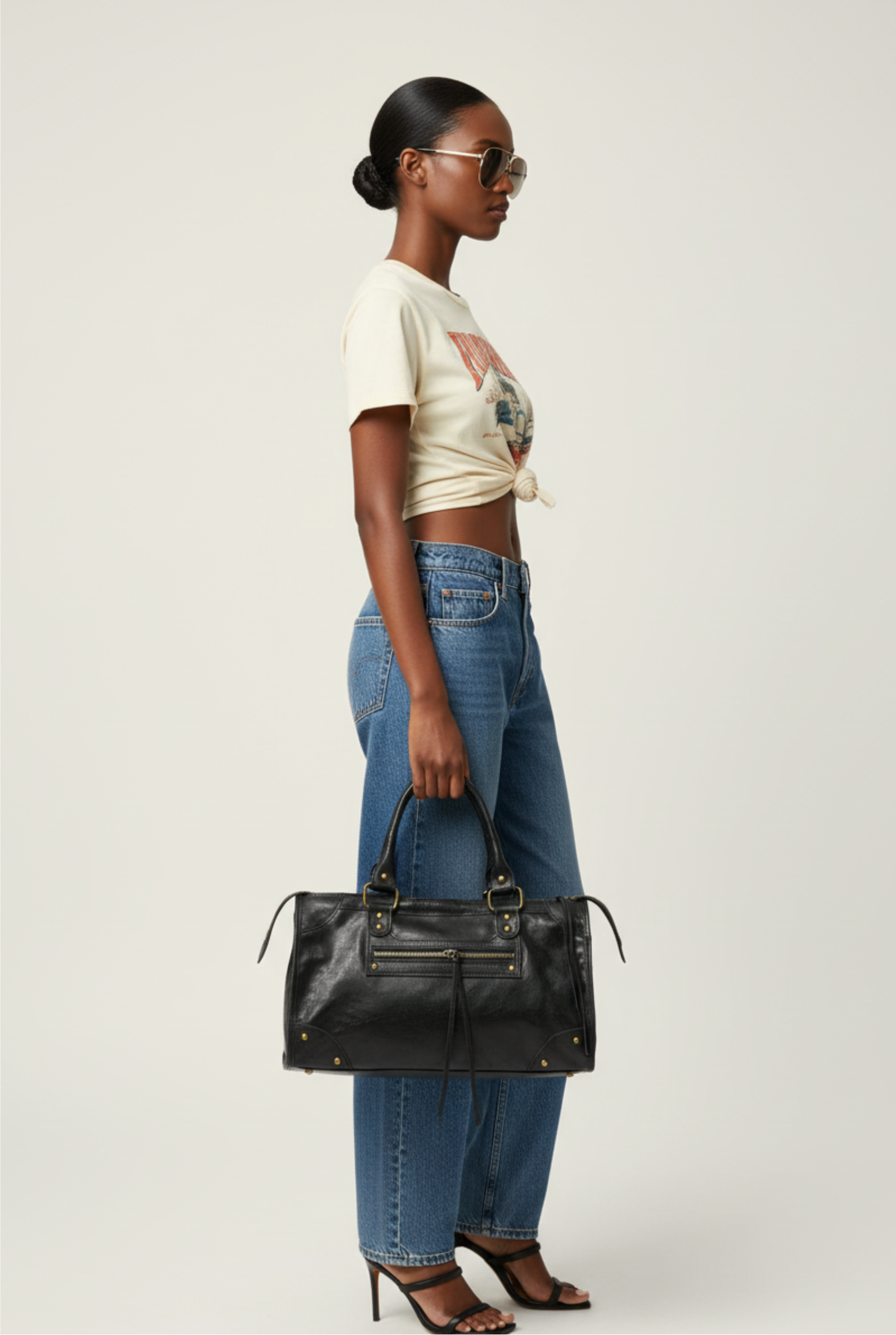 Model holding Verona Heritage Satchel in black leather by GOLD x TEAL.