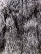 Close-up detail of gray fur texture on the GOLD x TEAL Aurelia Fur Coat showing natural variation and dimensional curl.