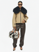 GOLDxTEAL BROOKLYN MONA JACKET WITH HANDBAG PHOTOGRAPHY.