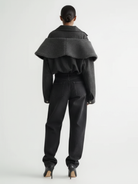 GOLD x TEAL charcoal denim jacket back view with wide sleeves.