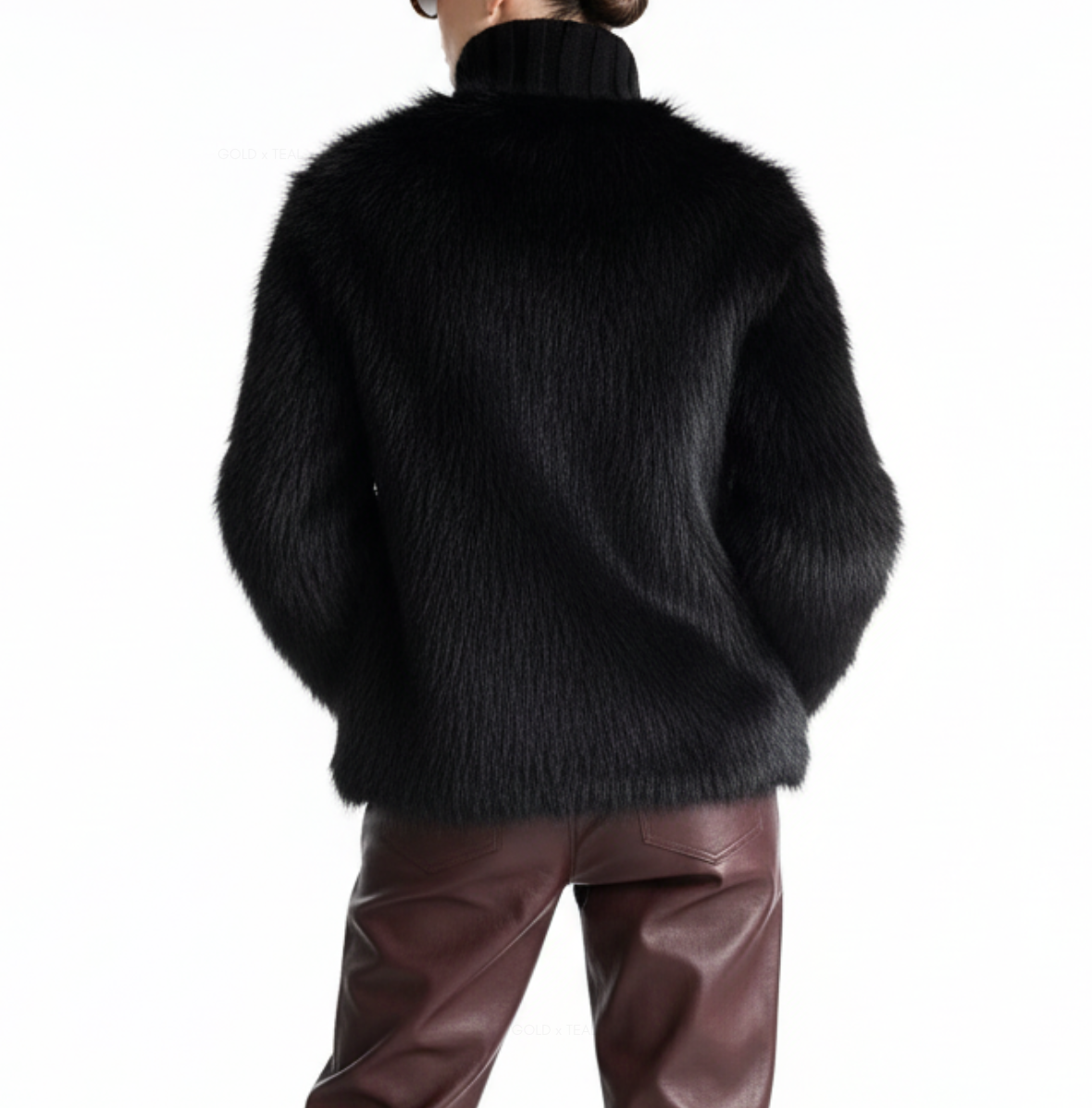 Back view of the GOLD x TEAL Maison Fur Sweater in black showcasing full faux fur back and textured knit construction.