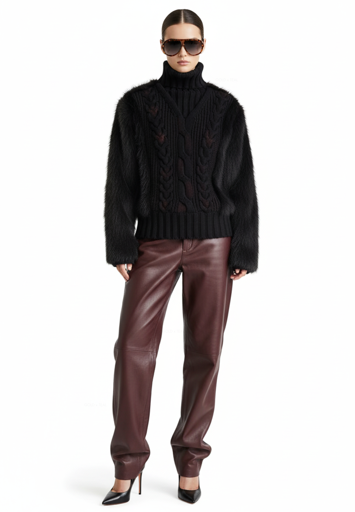 GOLD x TEAL Maison Fur Sweater in black shown on model, cable knit turtleneck with washed distressed finish and faux fur accents.