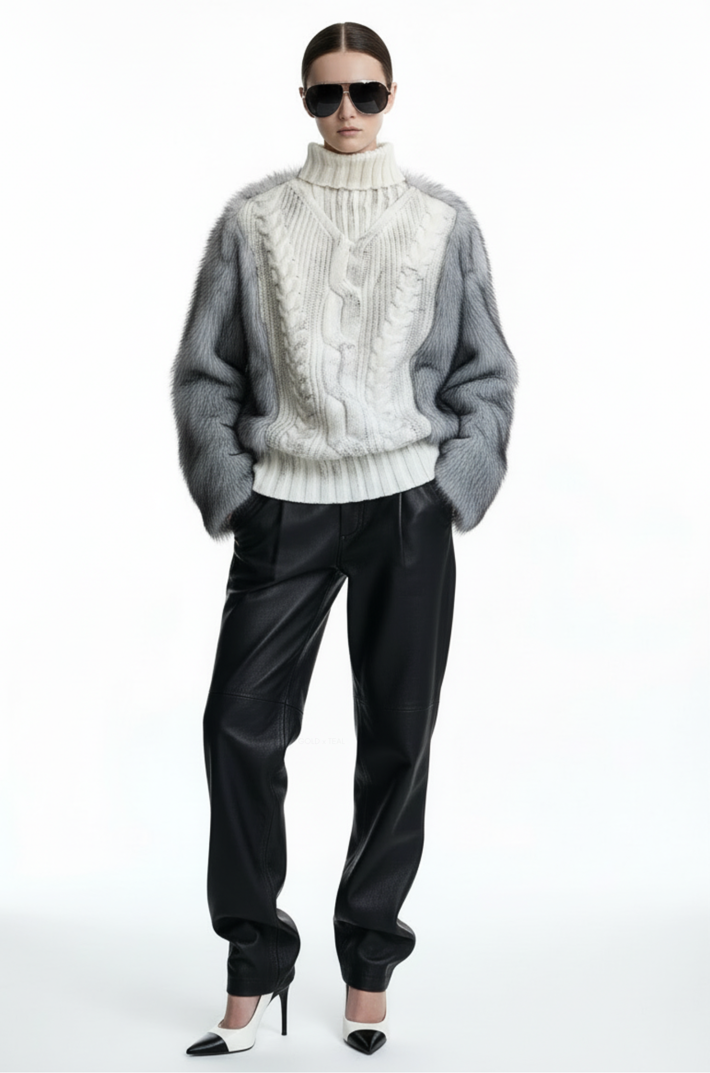 GOLD x TEAL Maison Fur Sweater in white shown on model, cable knit turtleneck sweater with faux fur sleeves and faux fur back panel. Relaxed look.