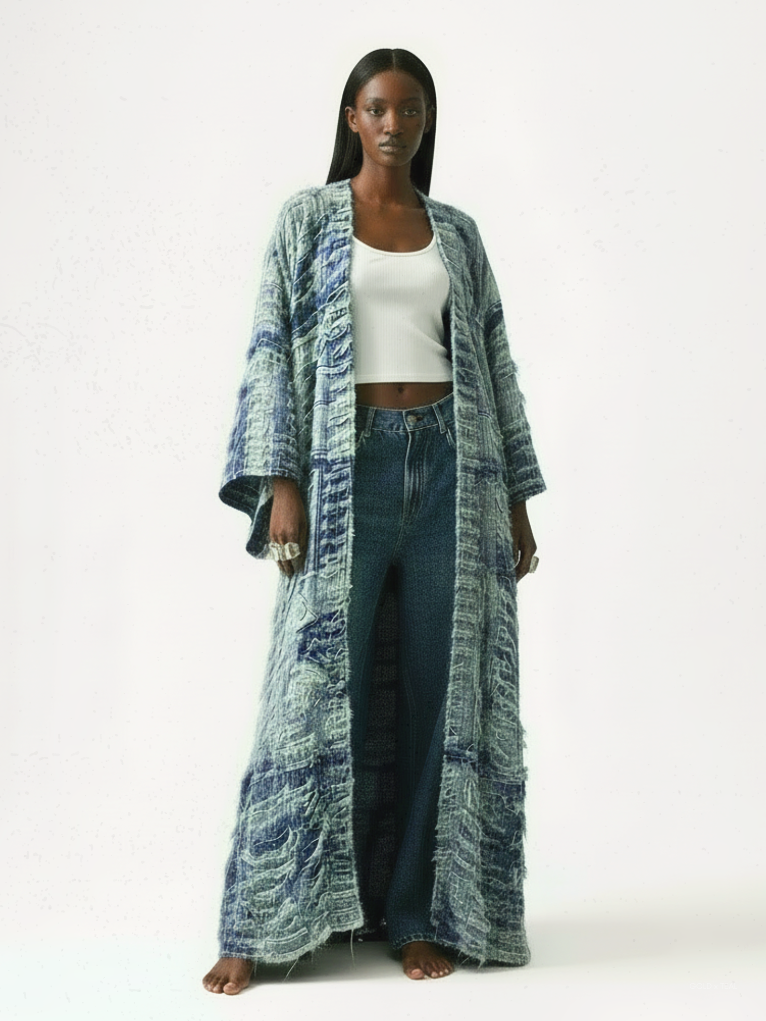 GOLD x TEAL Full-length studio portrait of model standing against a white background.