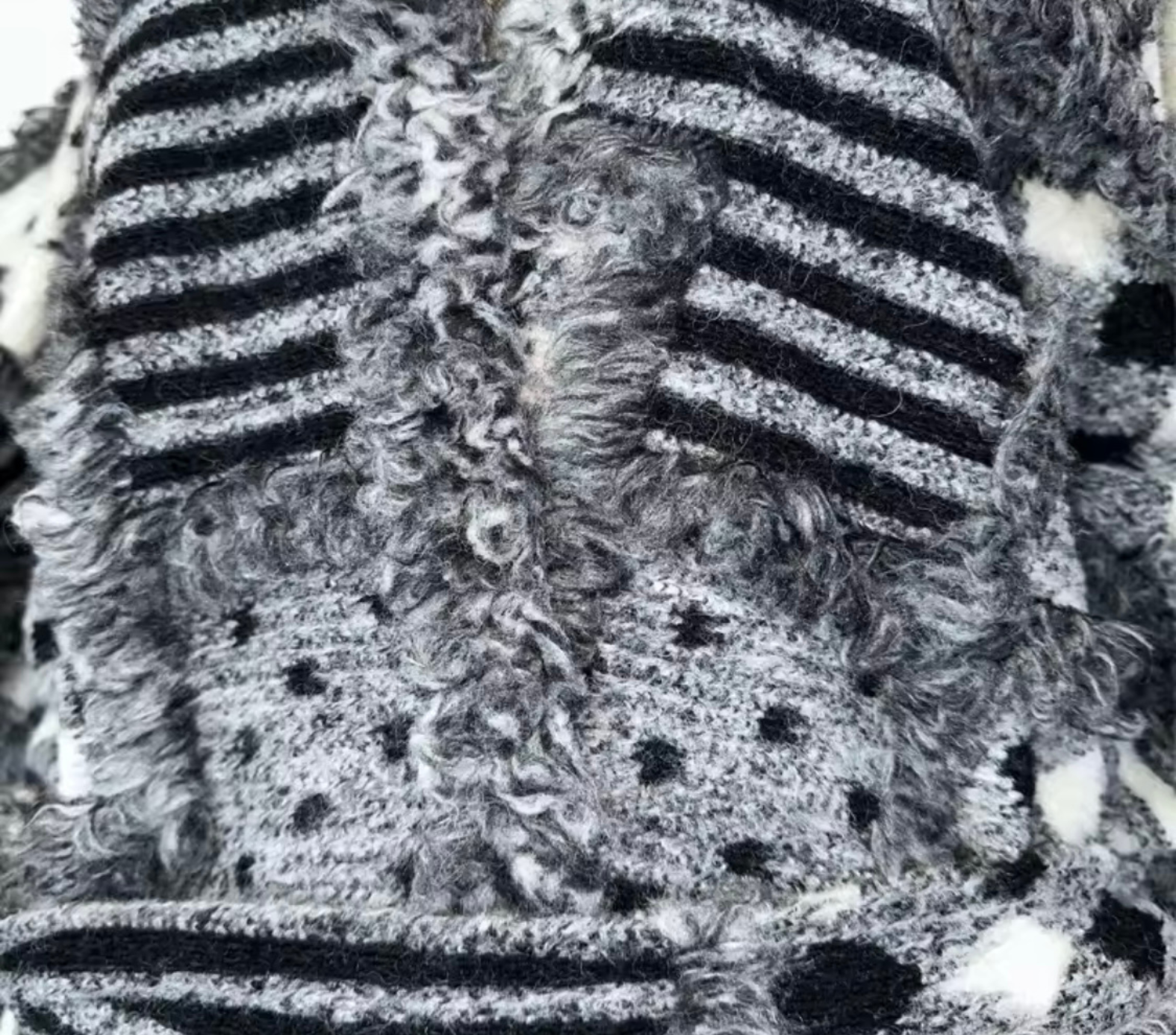 GOLDxTEAL Close-up view of the Noir Mosaic Duster showing the thick knit tatting texture and monochrome patchwork detailing.