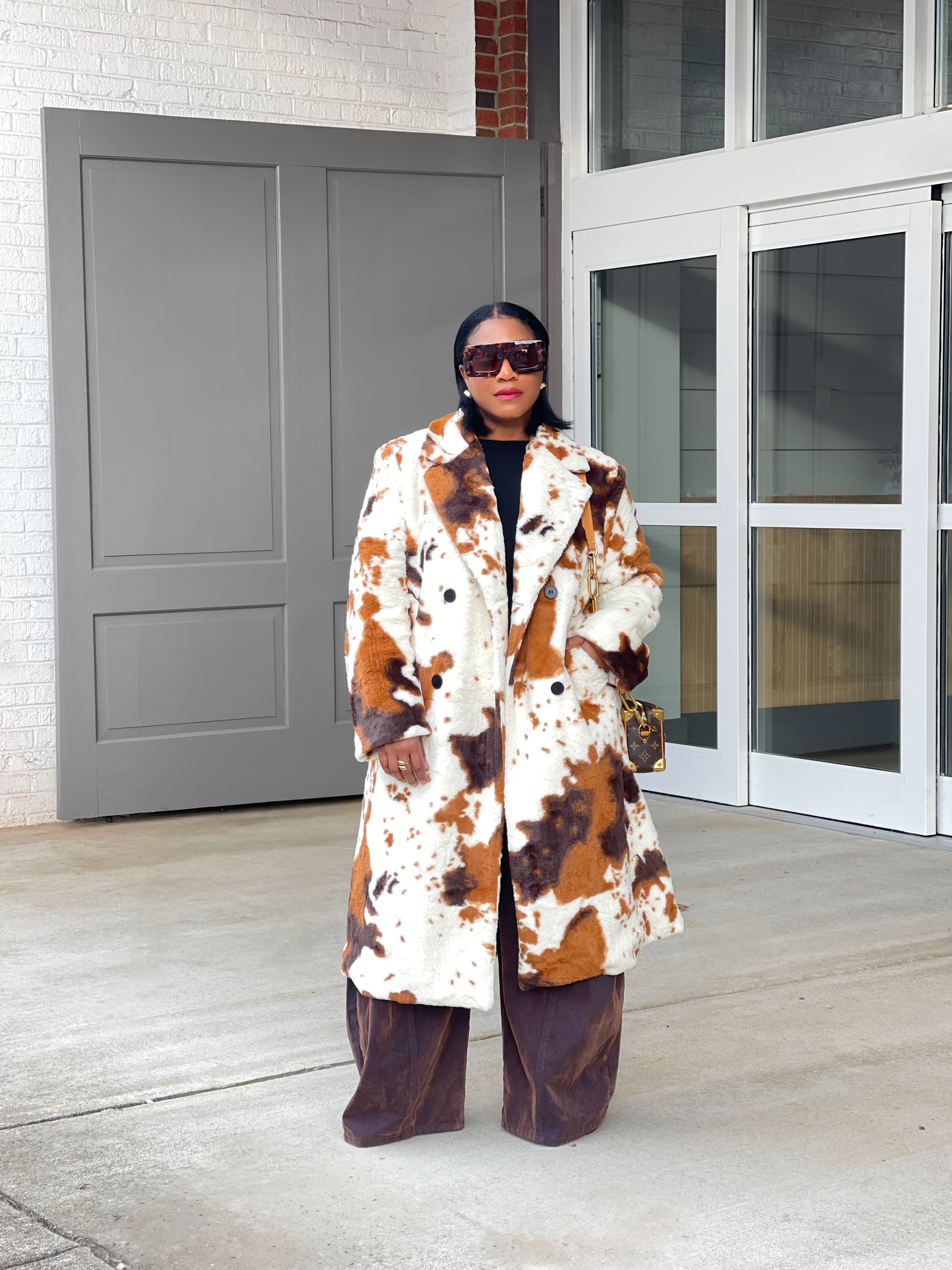 GOLDxTEAL cow print faux fur coat.