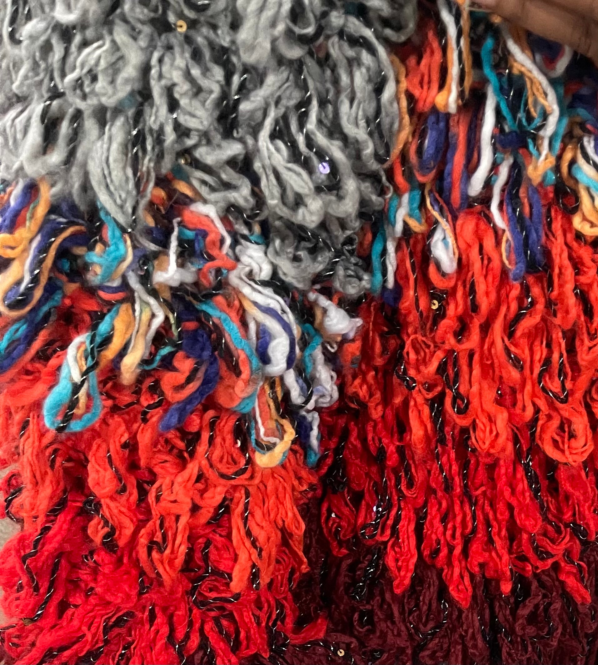 GOLD x TEAL Arte loop sweater close up on model.