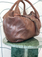 GOLDxTEAL gorgeous leather cognac hobo bag.