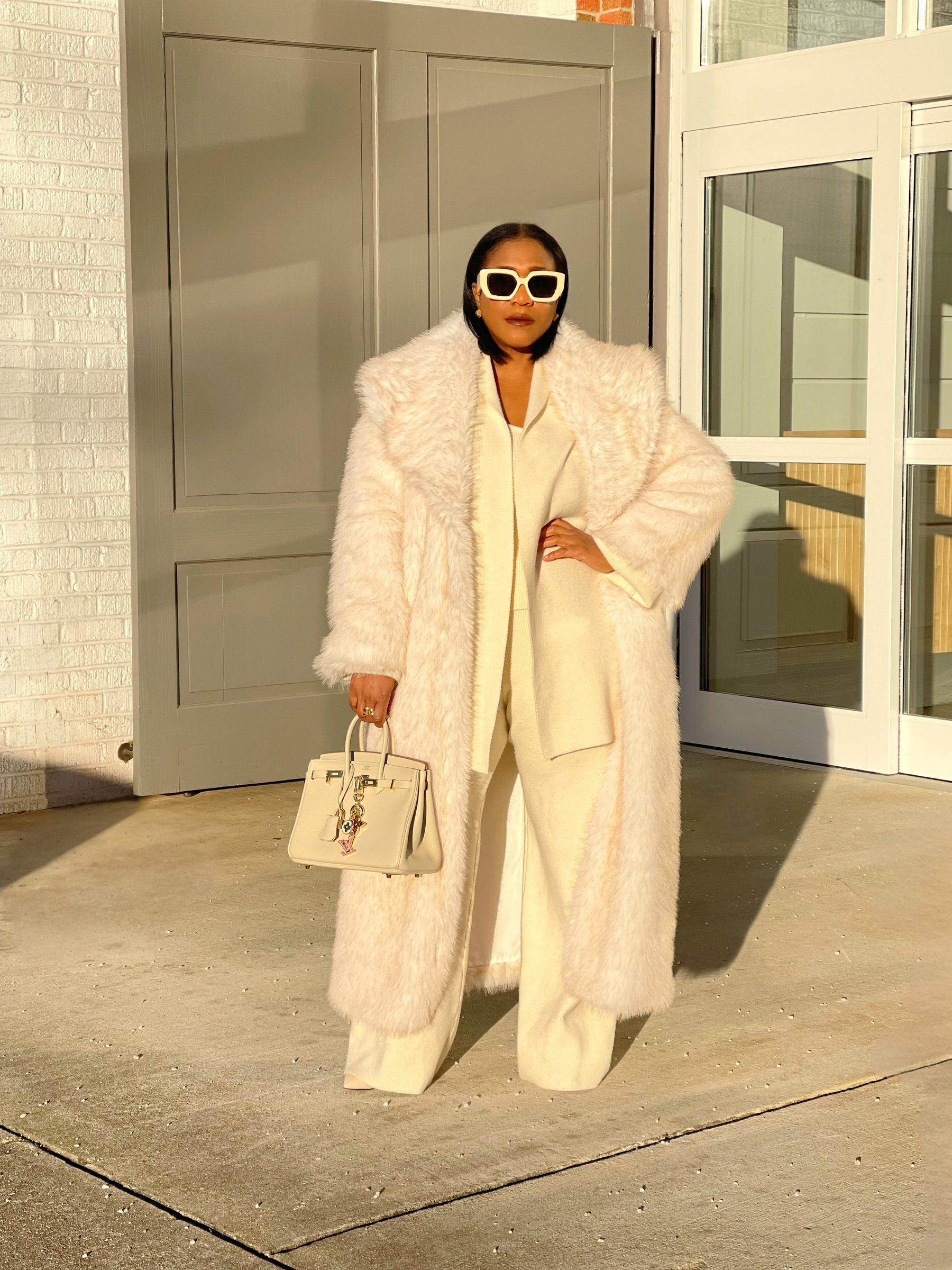 GOLDxTEAL plush cream faux fur coat.