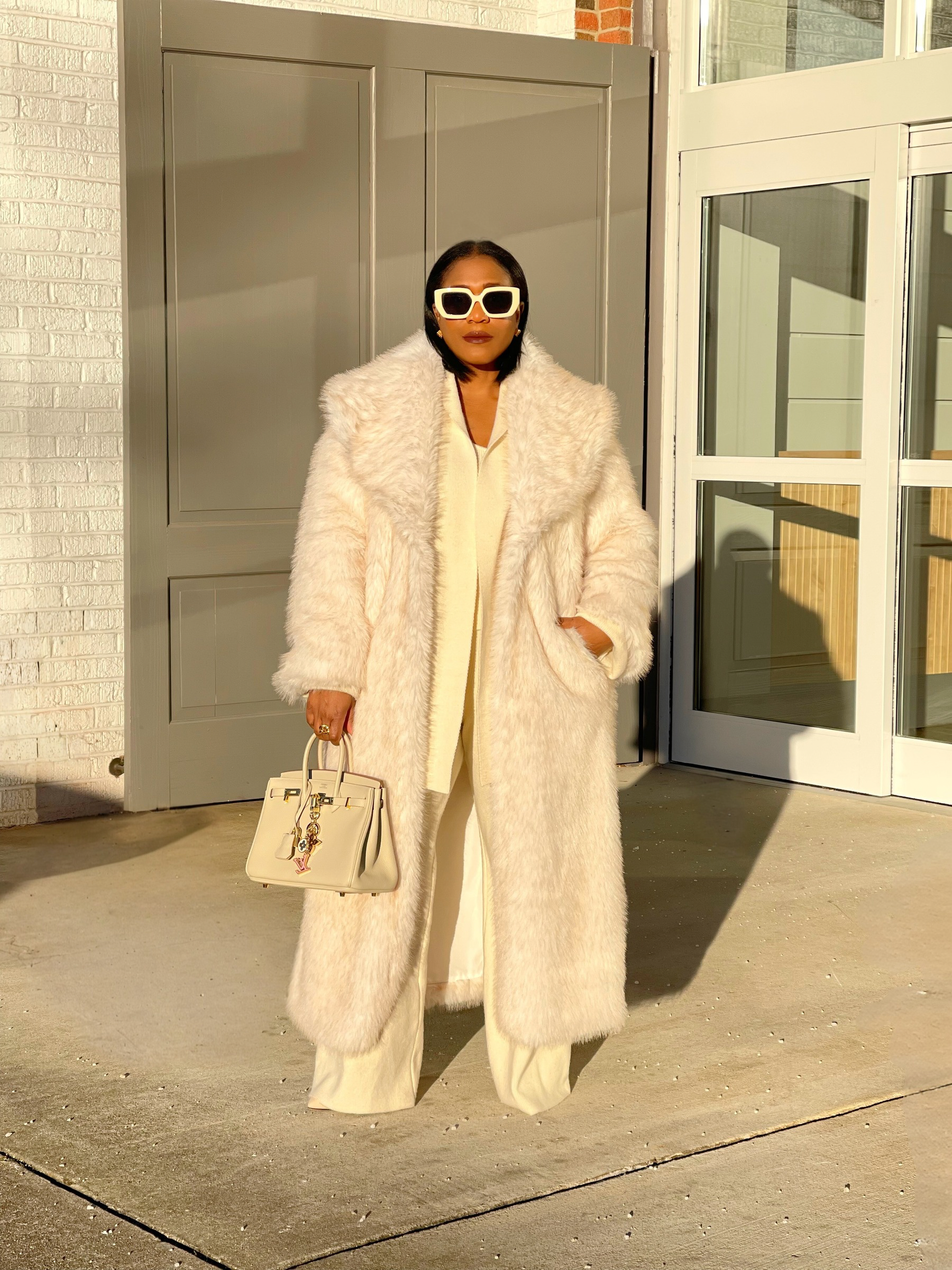 GOLDxTEAL plush cream faux fur coat.