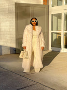 GOLDxTEAL plush cream faux fur coat.