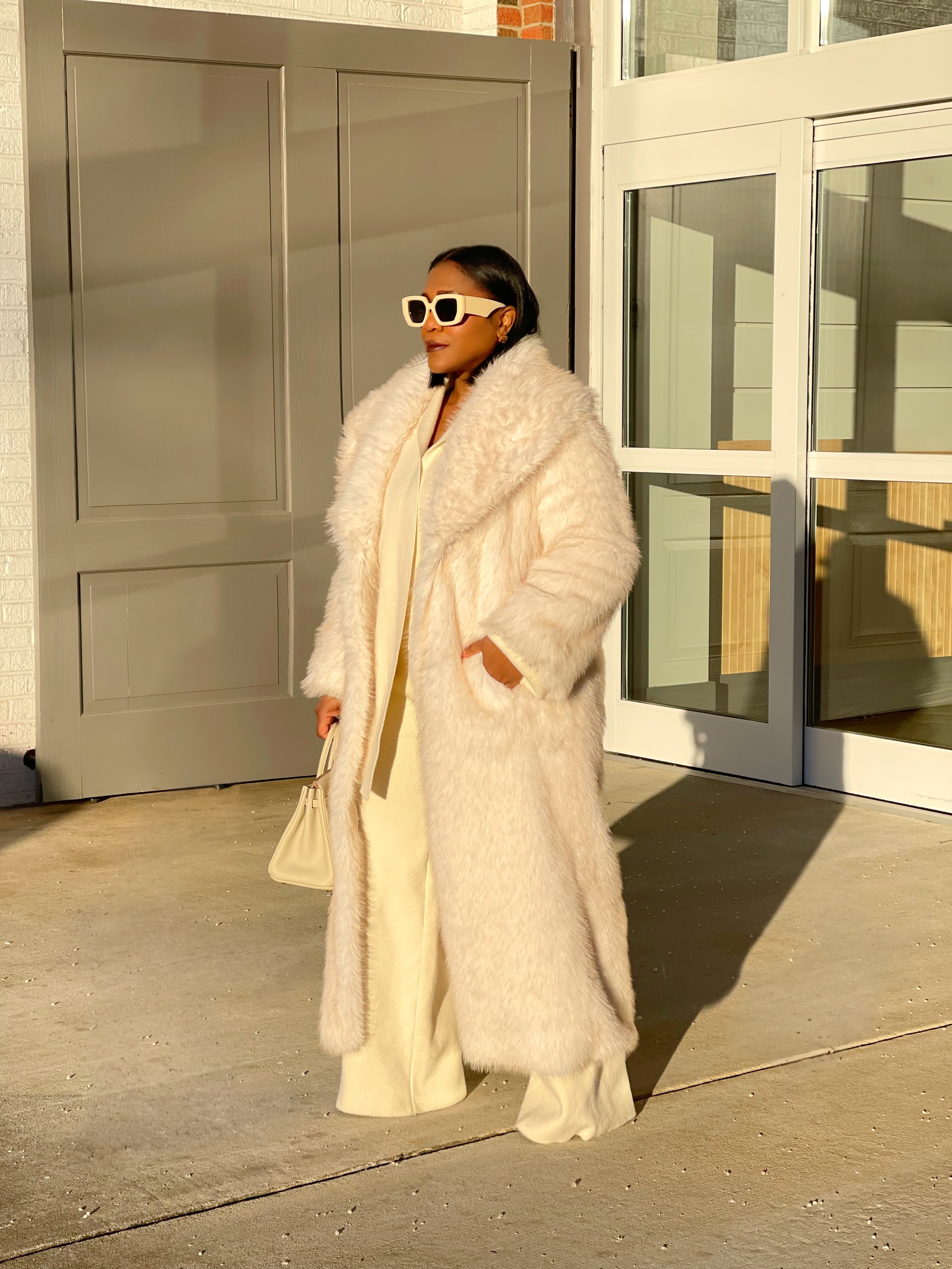 GOLDxTEAL 
plush cream faux fur coat.