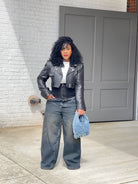 GOLDxTEAL high waisted black vintage blue paneled jeans.