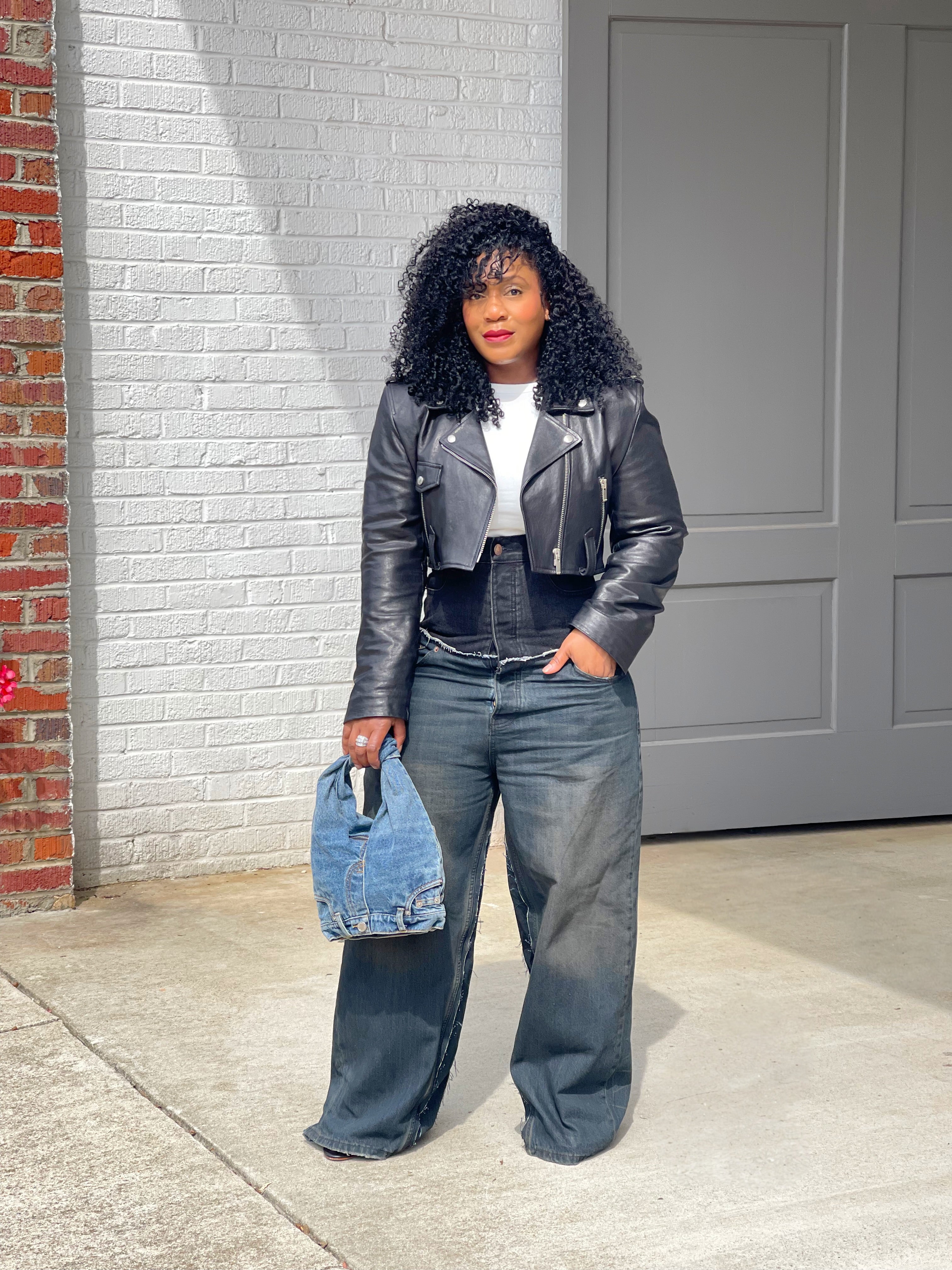 GOLDxTEAL high waisted black vintage blue paneled jeans.