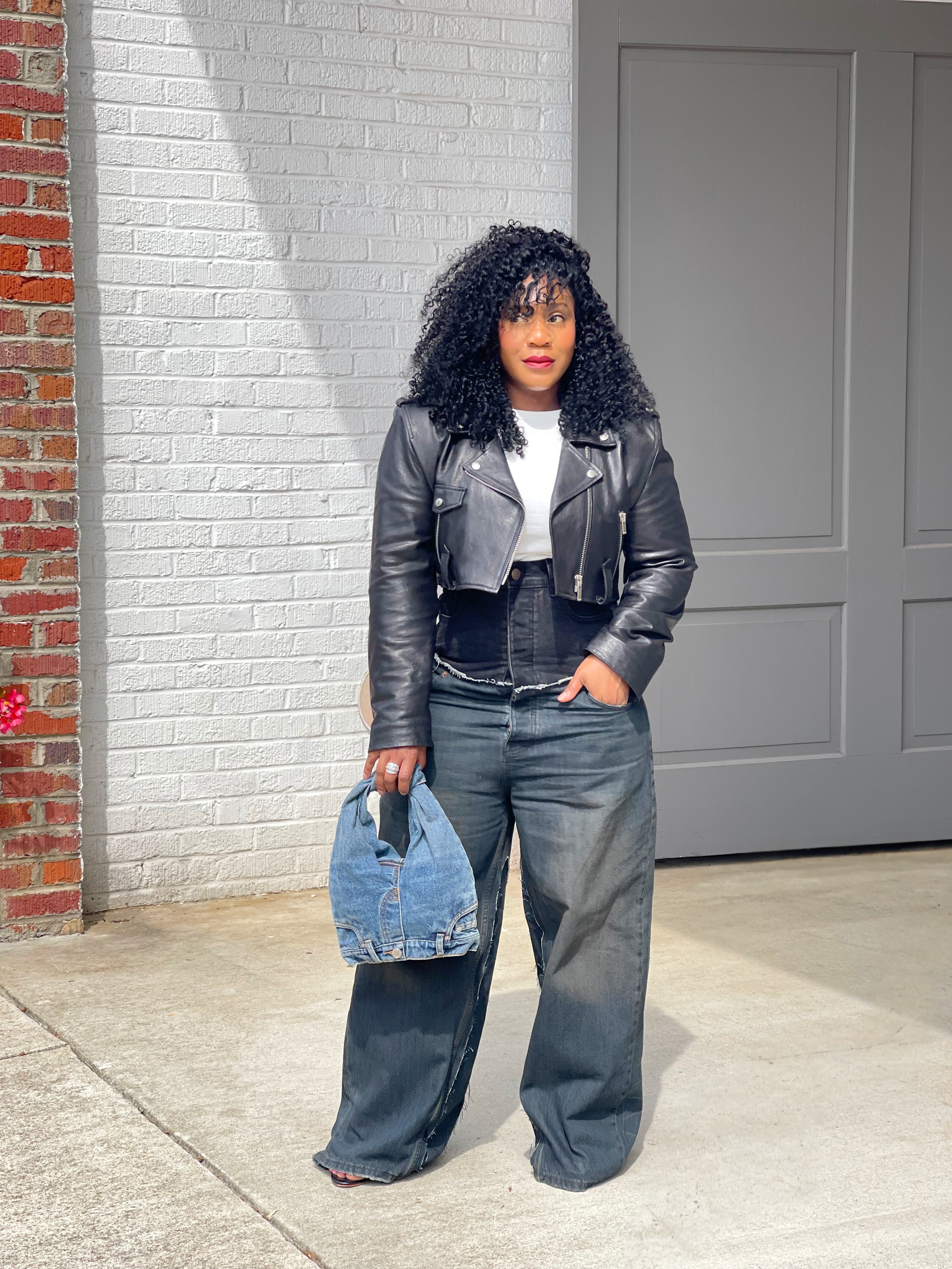 GOLDxTEAL high waisted black vintage blue paneled jeans.