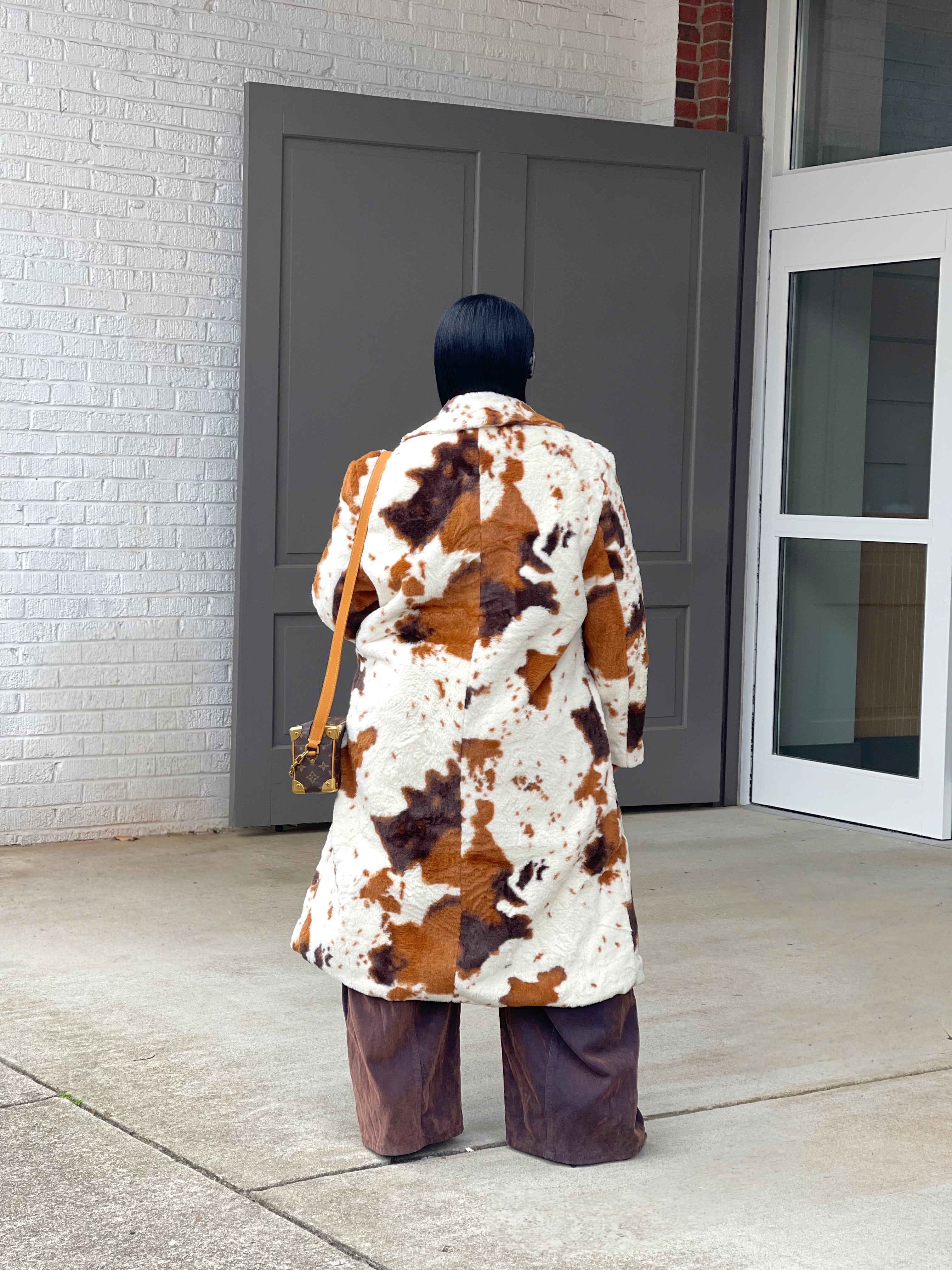 GOLDxTEAL cow print faux fur coat.